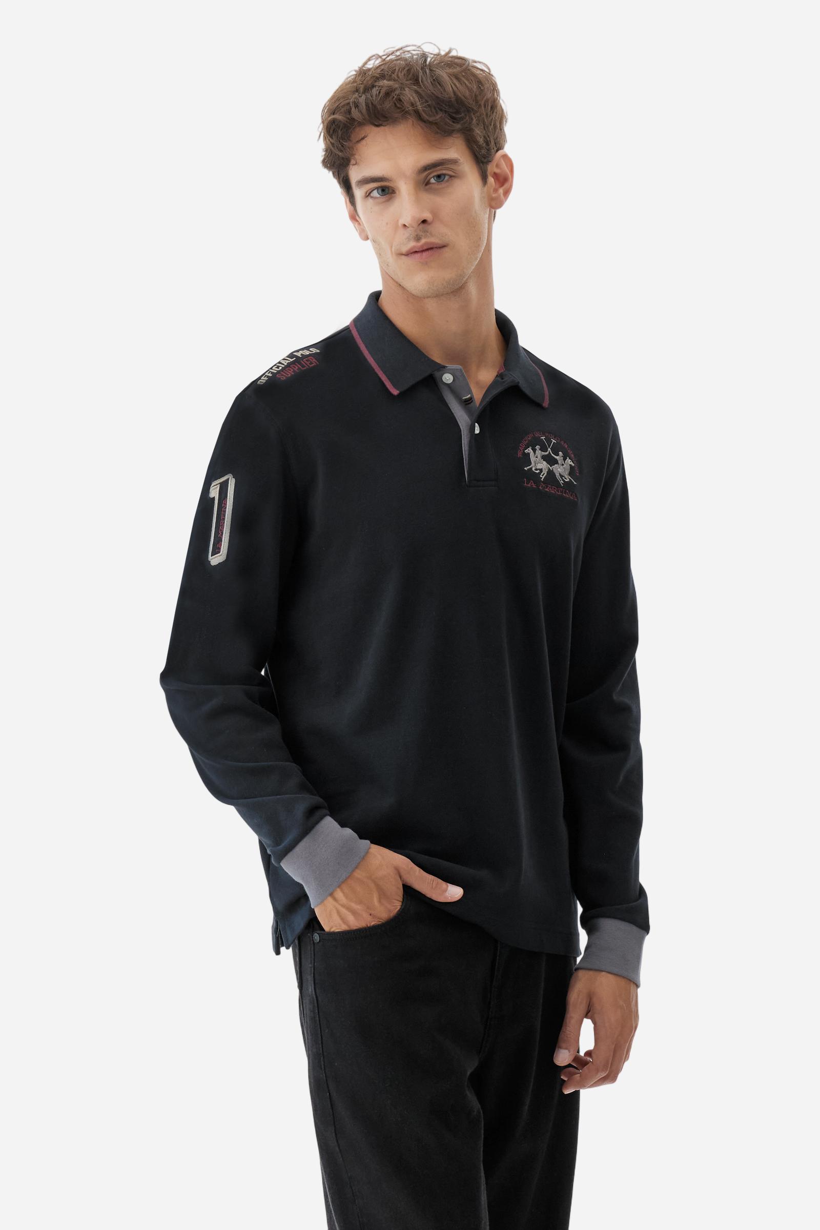 Men’s long-sleeve polo shirt in solid-colour cotton jersey with a warm, matte handfeel. Ribbed collar and cuffs with stripes and colour blocks in contrast, two personalised buttons and contrast details inside the collar. Patches and graphics on sleeves and chest celebrate the Official Polo Supplier team. The large multicolour logo is embroidered on the chest. Regular fit. The model wears size L. - Black