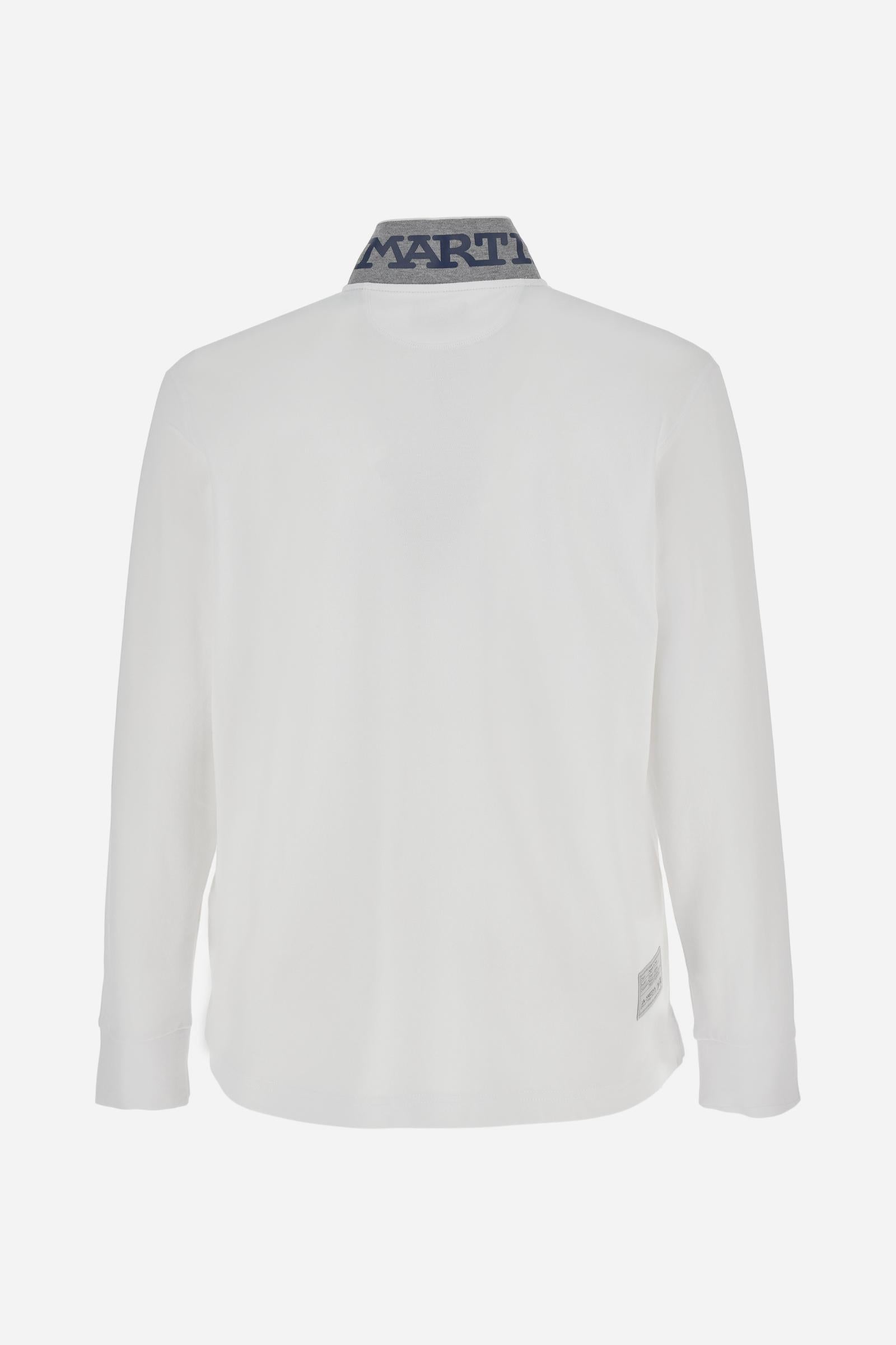Men's long-sleeved solid colour polo shirt. Made of high-quality stretch Piqué. The collar and cuffs are in solid colour ribbing. The undercollar features a print of the iconic La Martina lettering in a contrasting colour. Featuring a logo embroidered on the chest in a contrasting colour. On the back at the bottom, the guarantee label typical of the brand's iconic models is applied. Regular fit. The model is wearing a size L. - Optic White