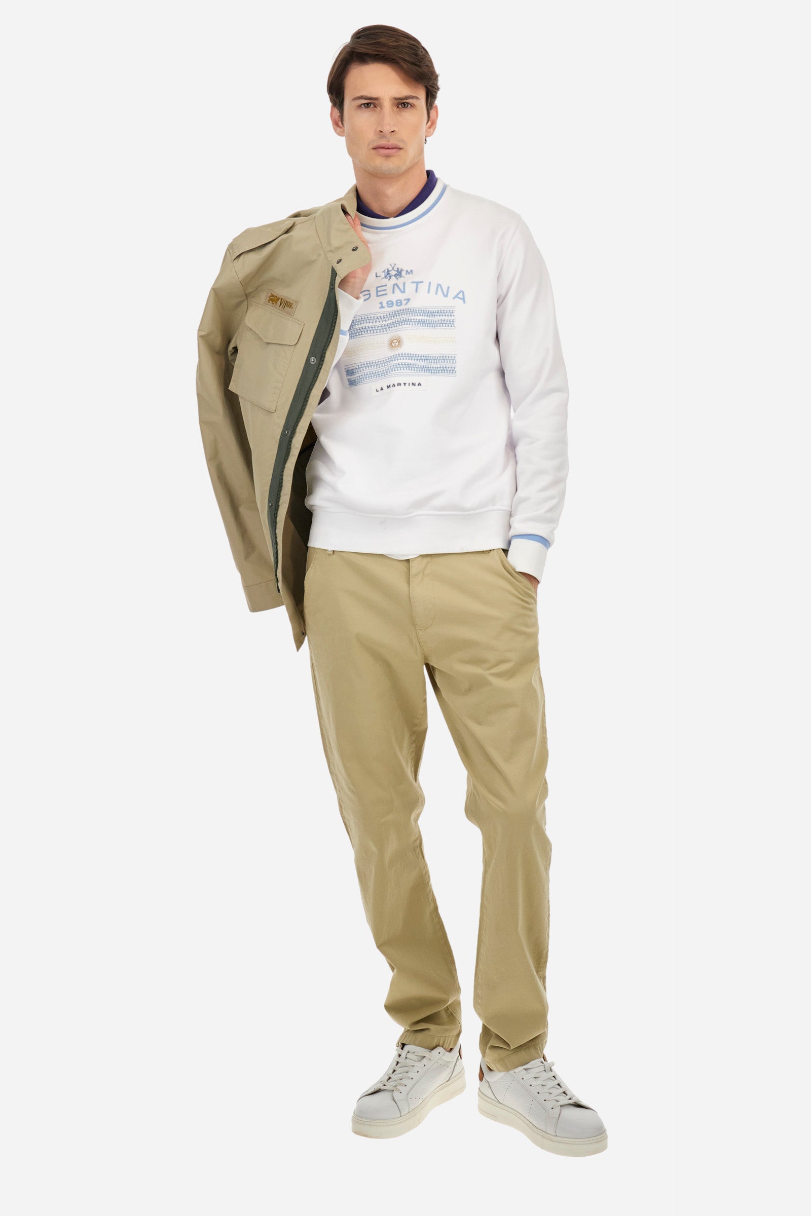 Men's crew-neck sweatshirt with long sleeves, single colour. Made in French terry cotton. The collar and cuffs are ribbed with a contrasting trim, while the waistband is also ribbed but in a matching colour. The large embroidery on the chest combines classic techniques, with workmanship that recalls a handmade spirit, together with the logo and initials of the brand. Regular fit. The model is wearing a size L. - Optic White