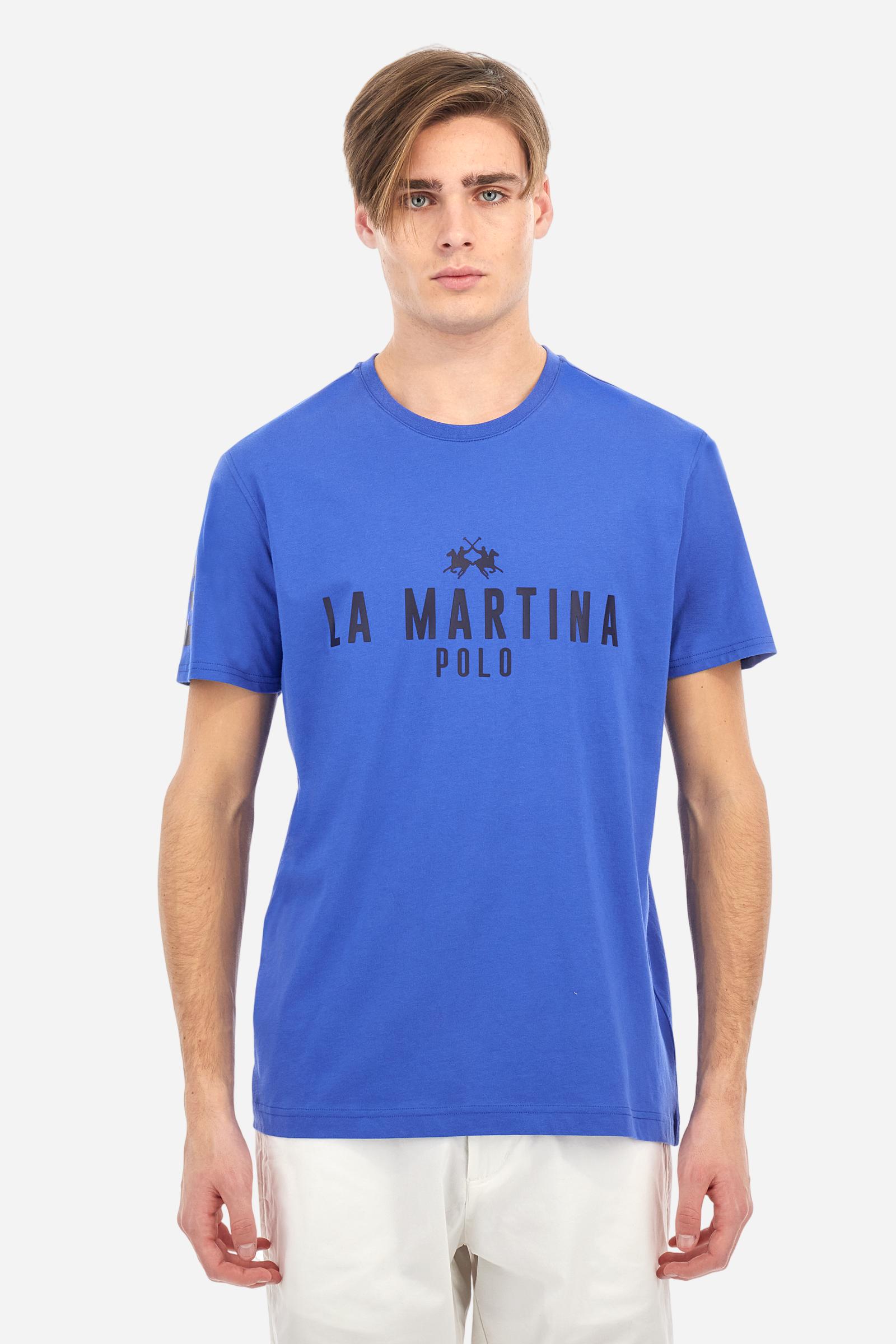 Men's single-colour crew-neck T-shirt with short sleeves, made of 100% cotton. The front features a printed logo and the lettering La Martina Polo. The number 3 is printed on one of the sleeves. Regular fit. The model is wearing a size L. - Dazzling Blue