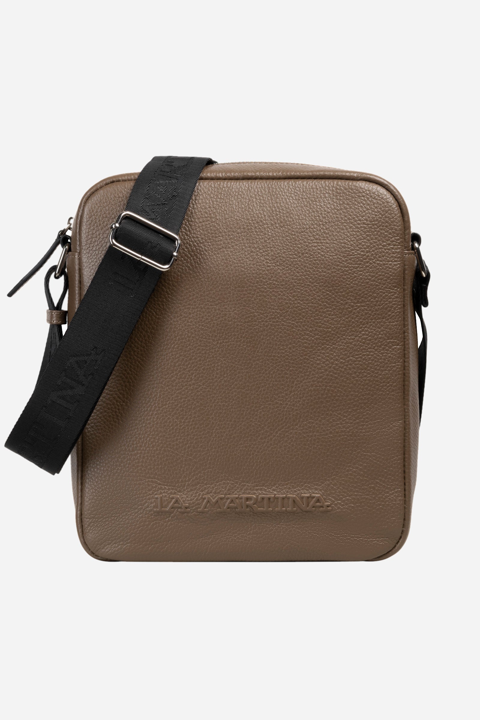 Single-colour men's crossbody bag, made from 100% leather. Featuring a zip fastening and adjustable shoulder strap. Inside there are two pockets: one open and one with a zip. The words 'La Martina' are embossed on the front. Dimensions (width x depth x height) 22x27x7cm. - Taupe Gray