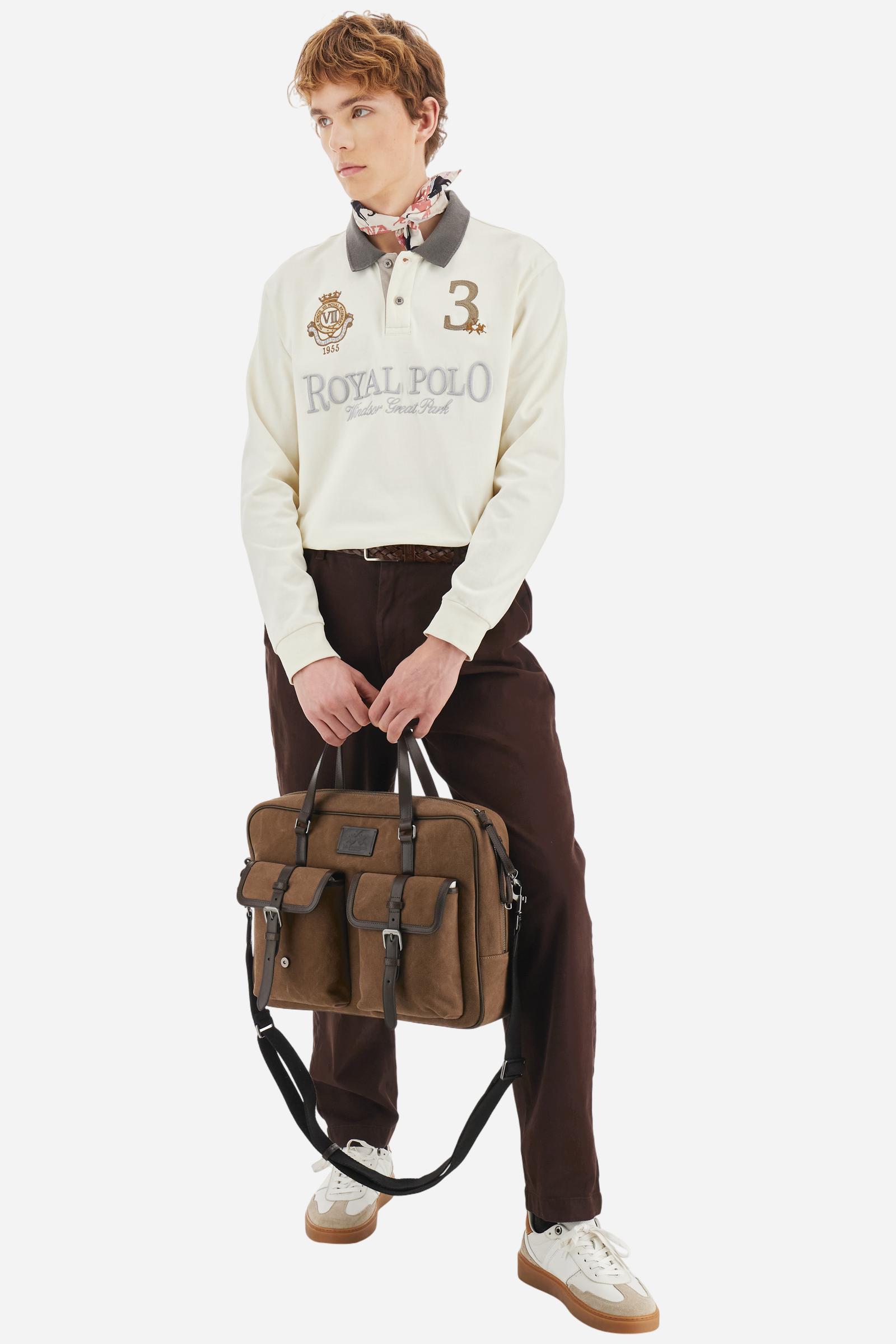 Men's long-sleeved solid colour, cotton jersey polo shirt. Two-button opening with contrasting details. Solid colour ribbed collar and cuffs. The chest features embroidered crests and lettering inspired by British royal heritage. The number 3 features on a patch with a fringed edge. The small brand logo is embroidered next to the number in contrasting colour. Regular fit. The model is wearing a size L. - Pristine