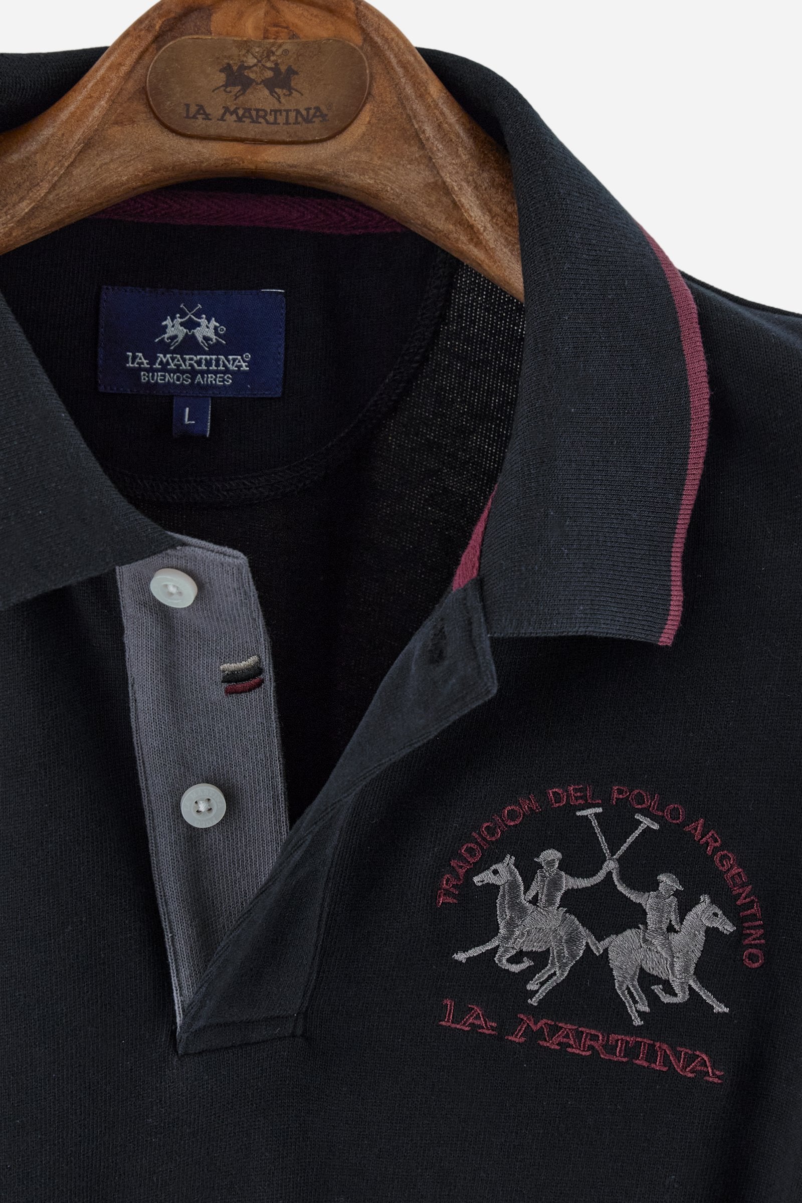 Men’s long-sleeve polo shirt in solid-colour cotton jersey with a warm, matte handfeel. Ribbed collar and cuffs with stripes and colour blocks in contrast, two personalised buttons and contrast details inside the collar. Patches and graphics on sleeves and chest celebrate the Official Polo Supplier team. The large multicolour logo is embroidered on the chest. Regular fit. The model wears size L. - Black