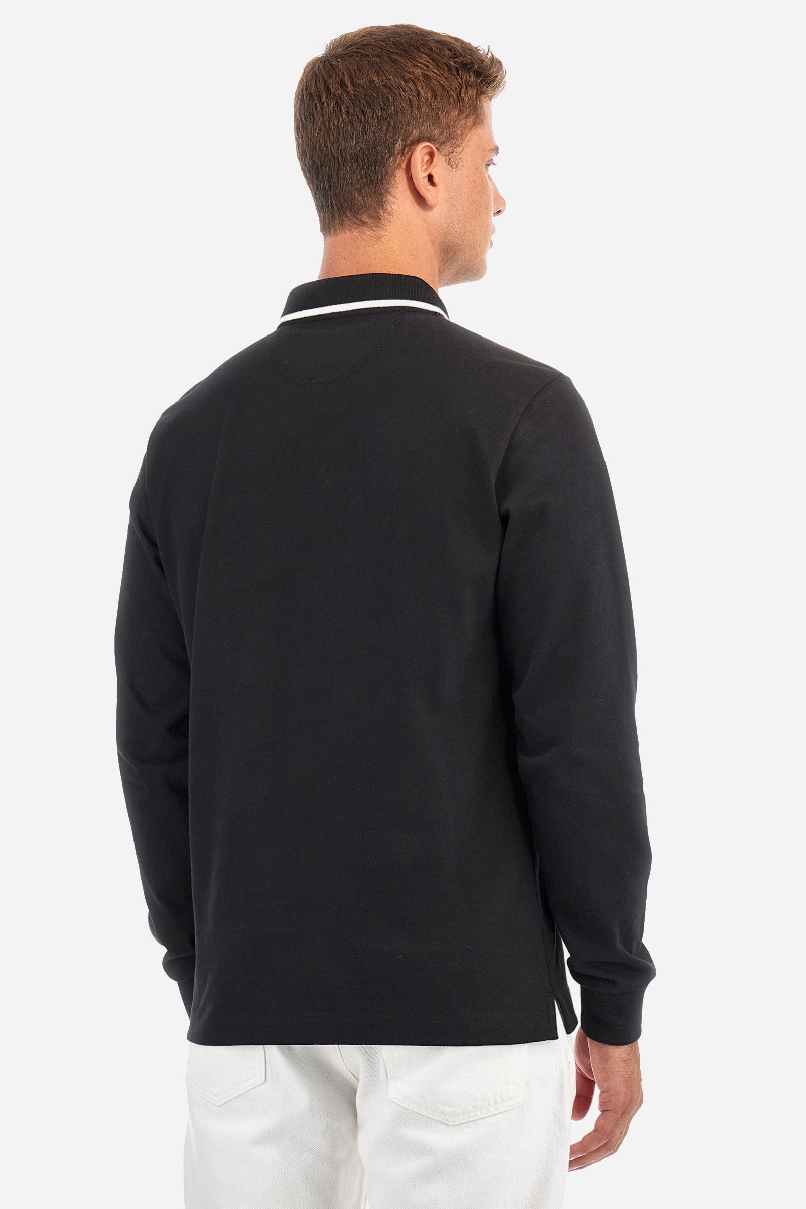 Men's single-colour long-sleeved polo shirt, made from 100% cotton. Two-button fastening. Profiled collar. In the centre of the garment is a contrasting colour stripe with La Martina printed on it. A patch and lettering are applied on the front. Regular fit. The model is wearing a size L. - Black