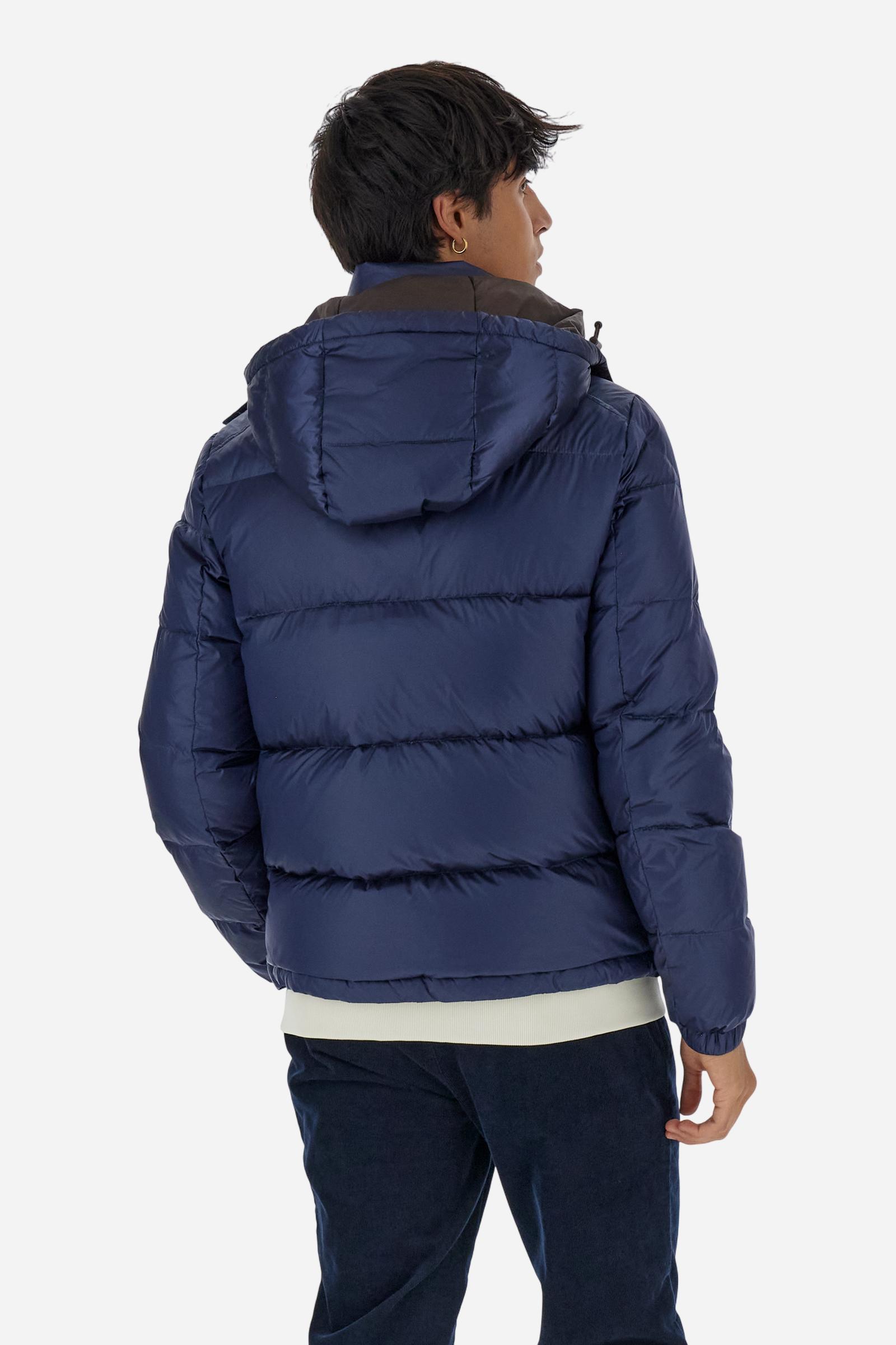 Men’s padded bomber jacket with detachable hood. Made of solid iridescent nylon with contrast lining. Equipped with two practical inner braces for extra comfort. Double customized zip front closure with inner placket featuring contrast Polo Player print, closed with metal snap buttons. Two vertical zipped pockets on the front. Hood with contrast lining and adjustable elastic drawstring. Bold Polo Player graphics printed inside. Regular fit for comfortable movement without bulk. Model wears size L. - Navy