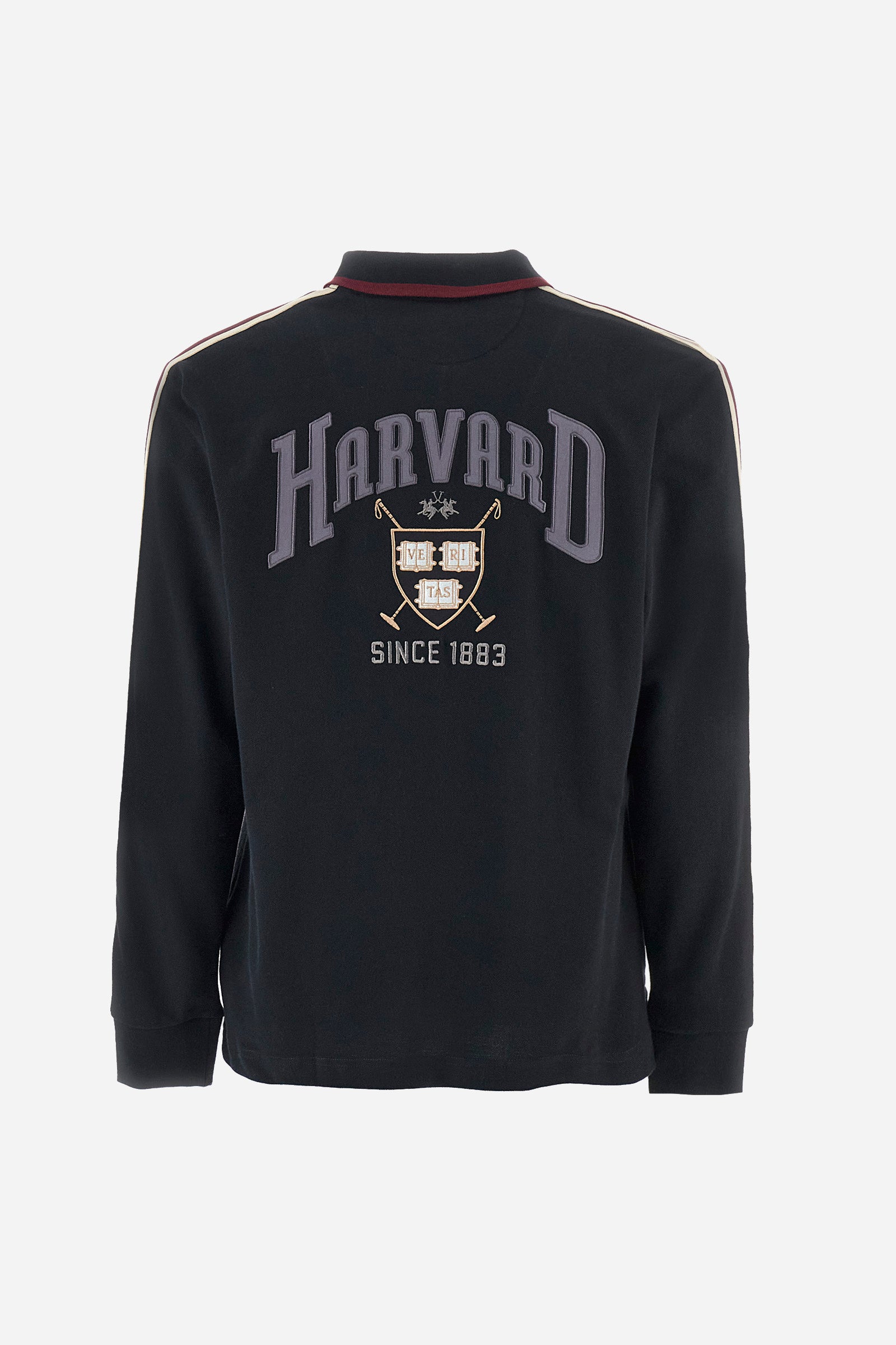 Men's plain short-sleeved polo shirt, made from 100% cotton. Half-zip fastening. Trimmed collar. The sleeves are finished with contrasting stripes. The symbols and lettering associated with the Harvard line are appliquéd on the back. The front is embroidered with the logo and La Martina lettering. Regular fit. The model is wearing a size L. - Black