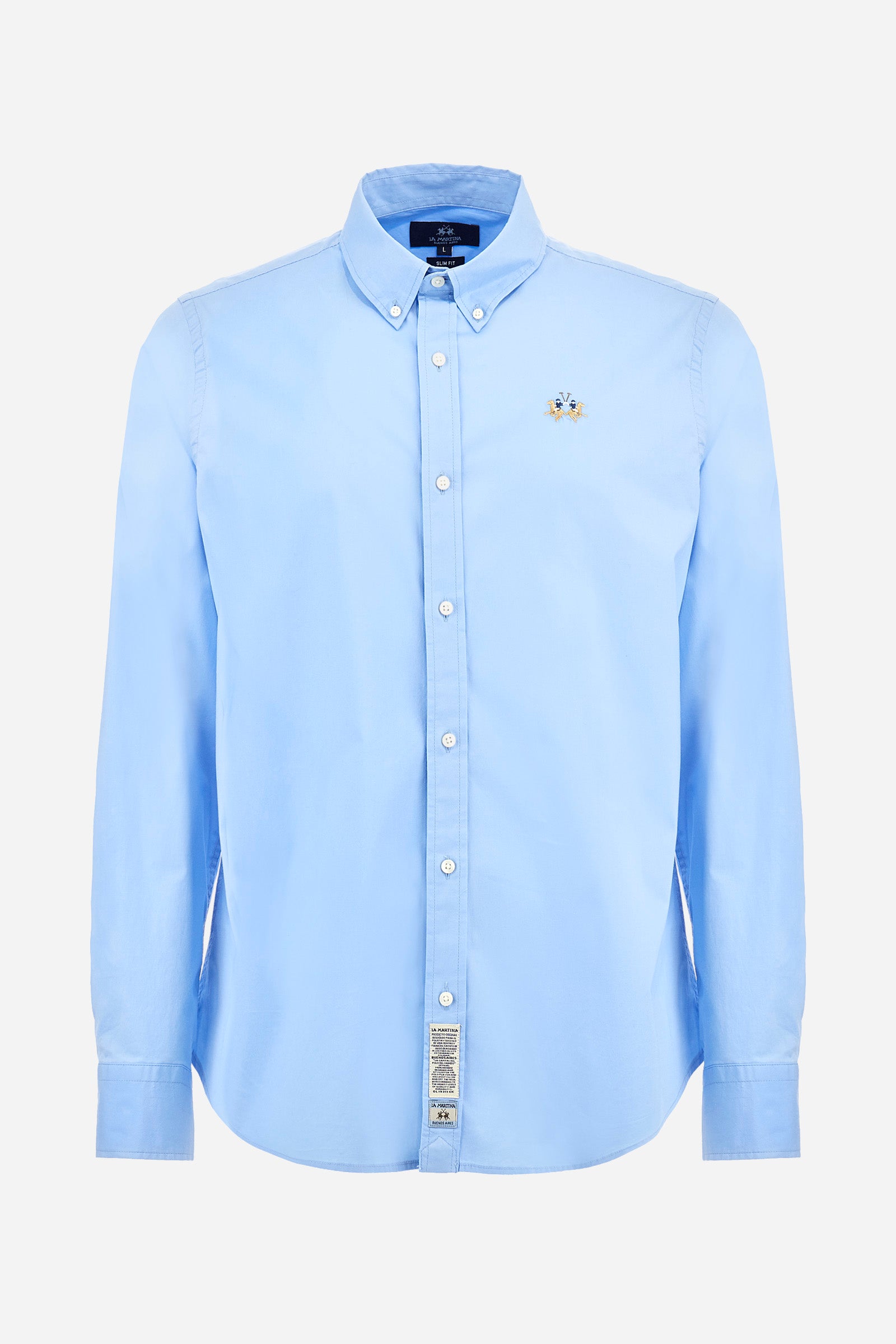 Men's single-colour shirt with long sleeves, made of stretch cotton. Button-down collar. With buttoned cuffs. Featuring a small embroidered logo on the front. Slim fit. The model is wearing a size L. - Blue Bell