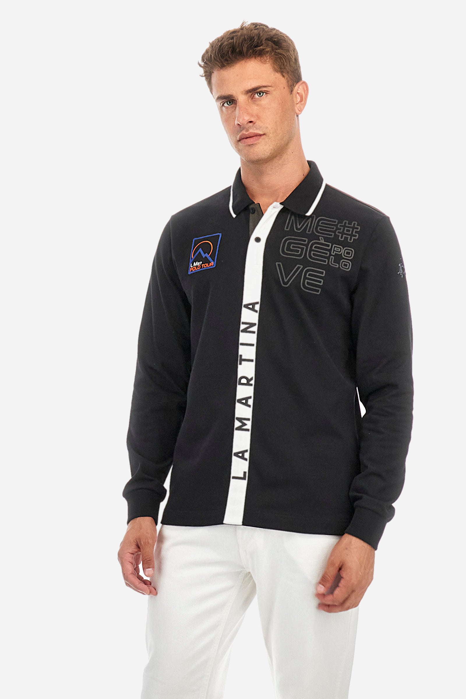 Men's single-colour long-sleeved polo shirt, made from 100% cotton. Two-button fastening. Profiled collar. In the centre of the garment is a contrasting colour stripe with La Martina printed on it. A patch and lettering are applied on the front. Regular fit. The model is wearing a size L. - Black