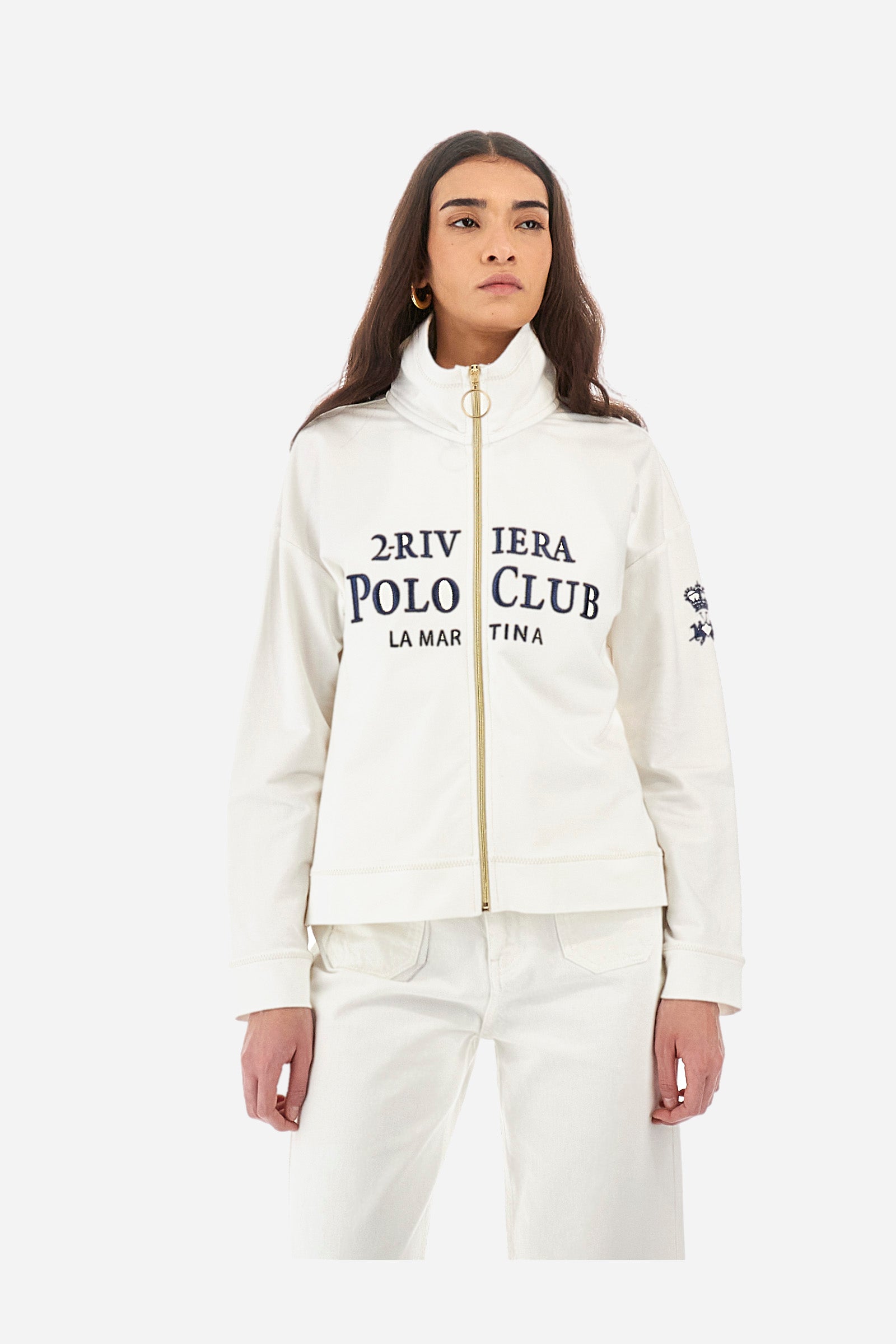 Women’s sweatshirt with long sleeves in solid color with full zip closure in contrasting tone. Made of stretch cotton. Wide neck, can be zipped up high. Contrasting embroidered lettering and logos on the front and sleeves recall the Polo Club Grand Hotel capsule collection. Regular fit. The model wears a size 2. - Off White