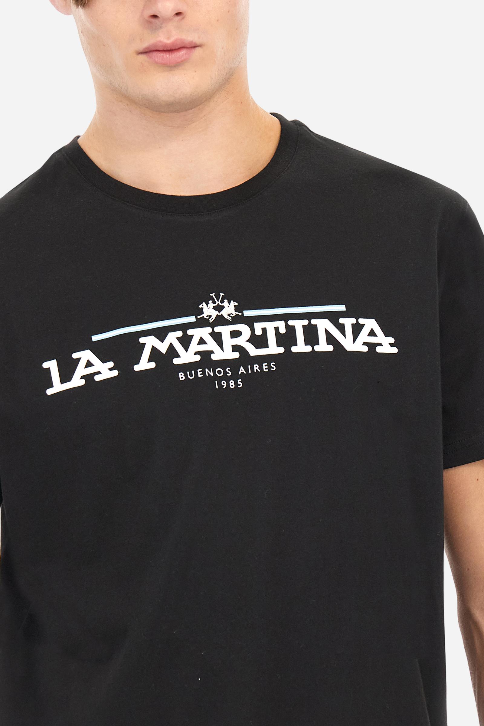 Men's solid color T-shirt, made of cotton jersey. Crew neck. The front features the La Martina text in print. The logo is embroidered on the front, in the center of the chest. The fit is regular. The model is wearing size L. - Black