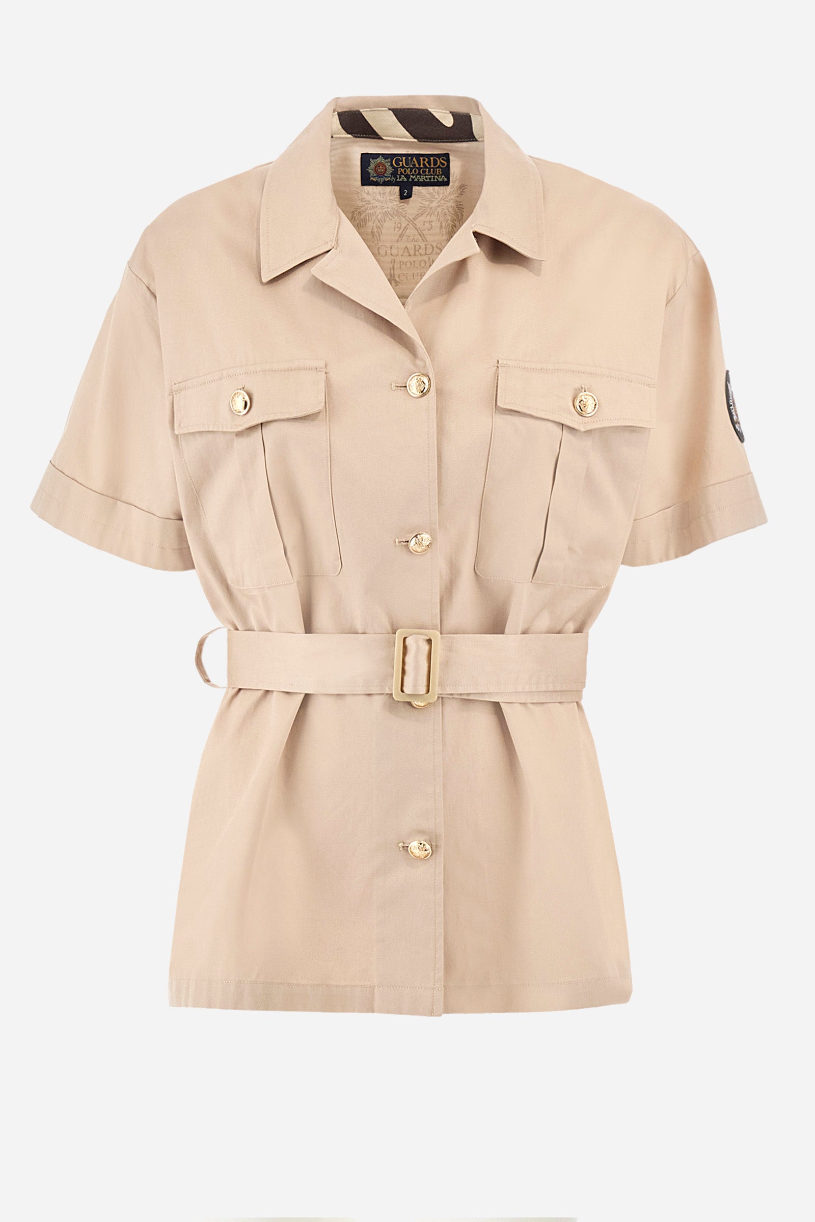 Short-sleeved jacket in solid color, made of 100% cotton twill. French collar. Buttons as closure along the head and on the two front pockets. Removable fabric belt supplied. Mini patch that recalls the capsule Guards applied on one of the sleeves and a mini logo applied on metal plate. The fit is regular. The model wears a size 2. - Tidal Foam