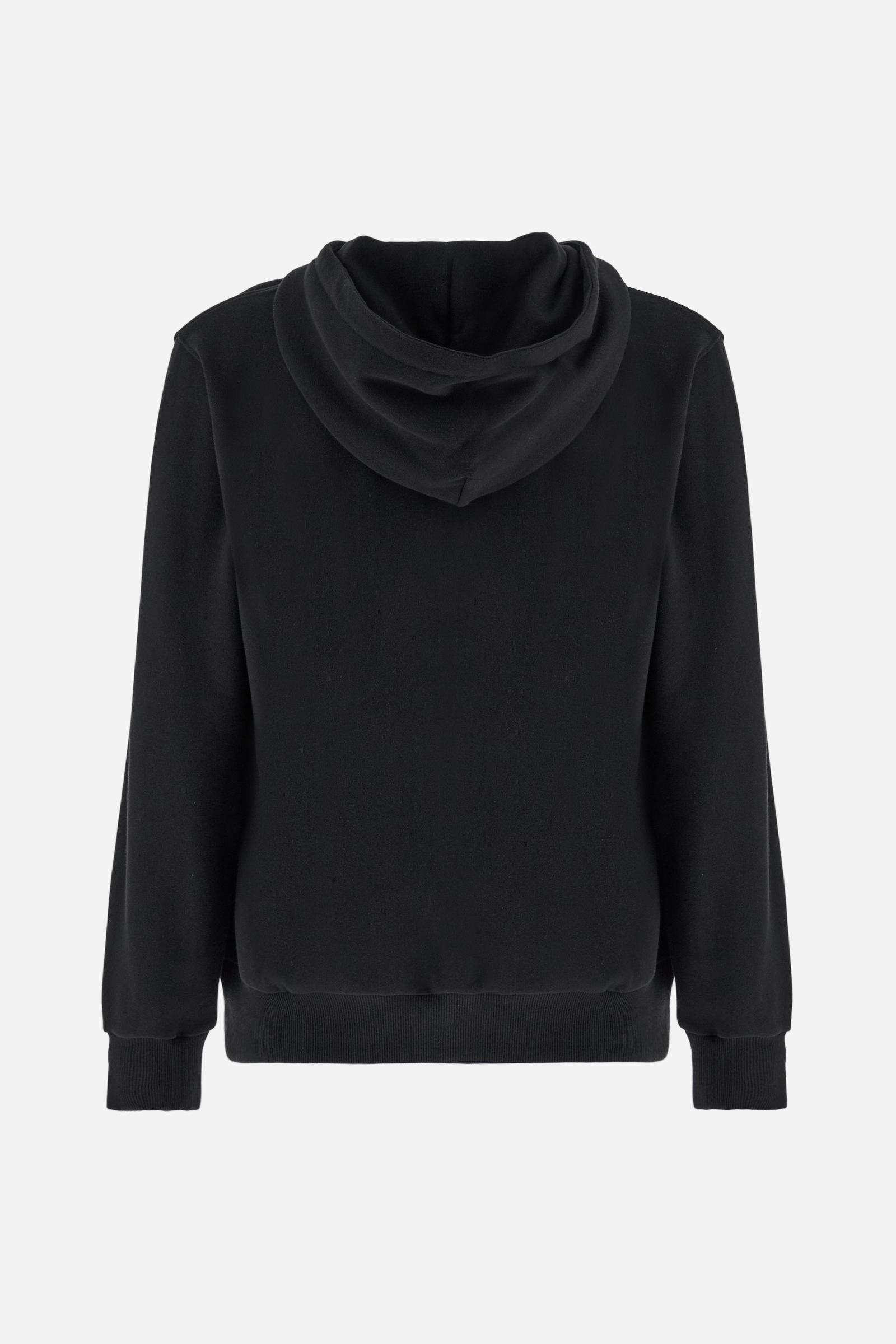 Men's long-sleeved hoodie in solid colour, made from soft 100% cotton fleece with a velvety touch. The model features a customised front zip and an adjustable hood with drawstring. Hem and cuffs in tone-on-tone rib. Iconic brand graphics stand out on the chest, embroidered with numbers and lettering. Regular fit ensuring comfort and freedom of movement. Model wears size L. - Black