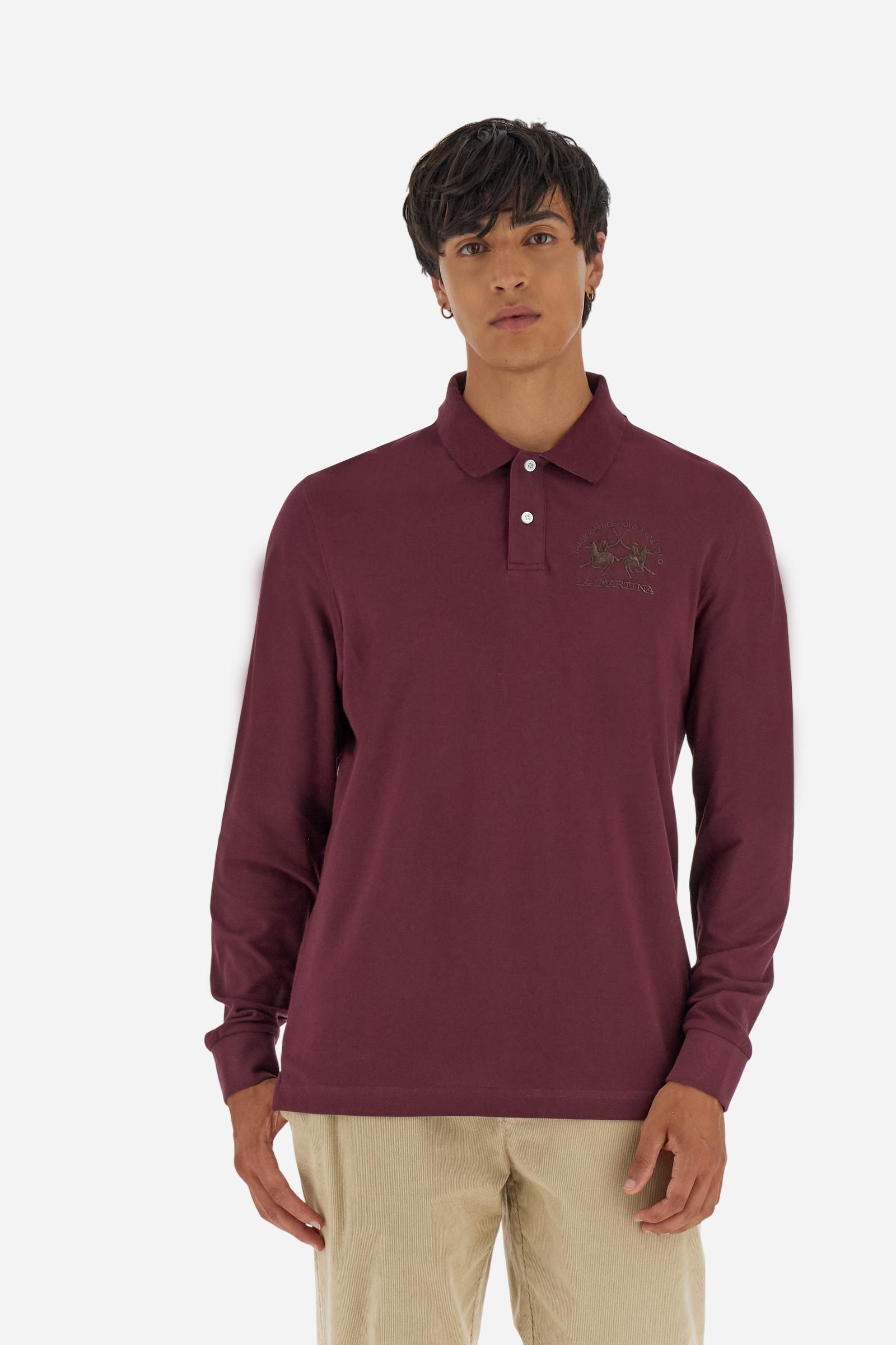 Men's long-sleeved solid colour polo shirt. Made of high-quality stretch Piqué. The collar and cuffs are in solid colour ribbing. The undercollar features a print of the iconic La Martina lettering in a contrasting colour. Featuring a logo embroidered on the chest in a contrasting colour. On the back at the bottom, the guarantee label typical of the brand's iconic models is applied. Regular fit. The model is wearing a size L. - Port Royale
