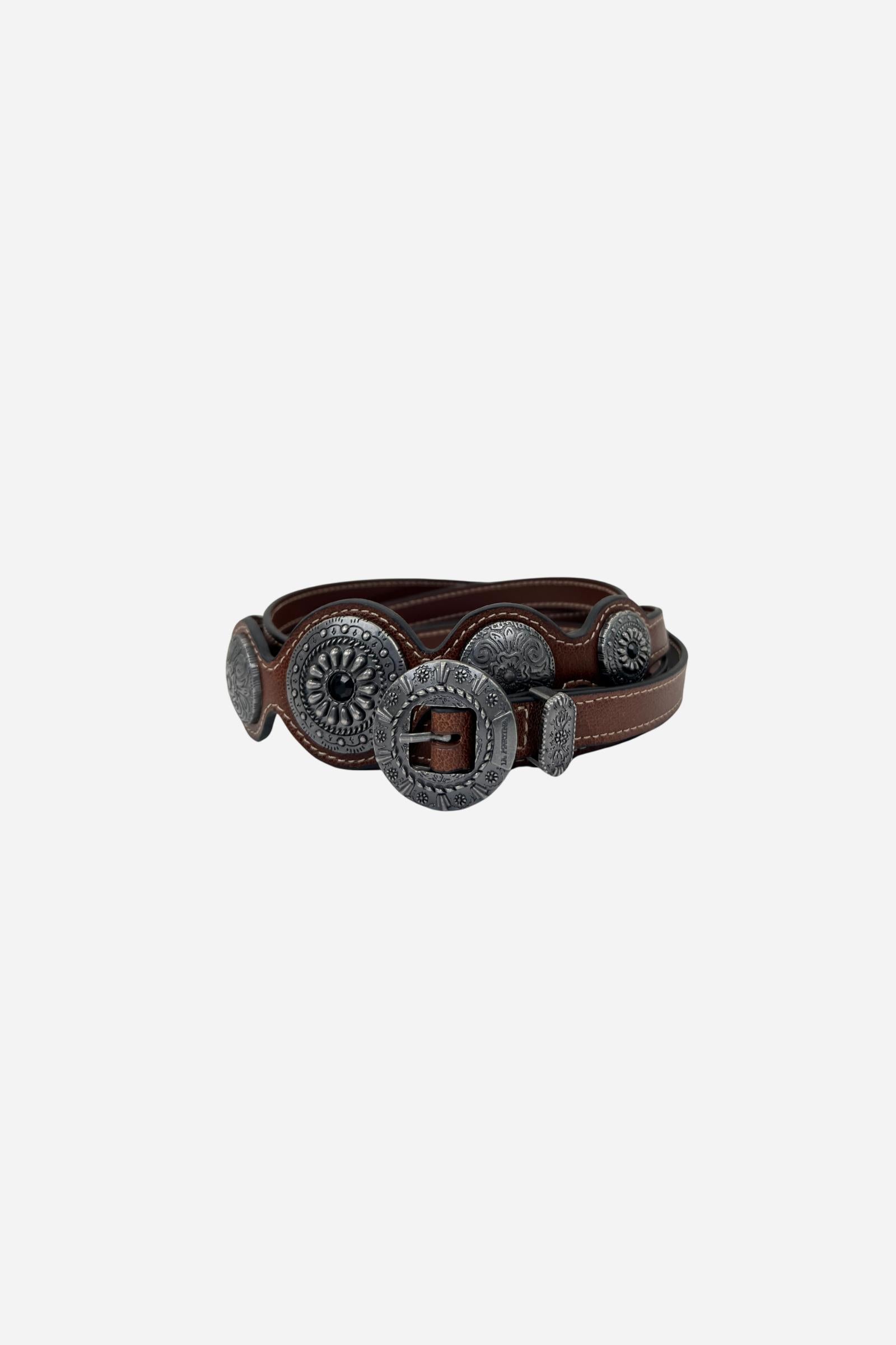Full-grain leather women's belt with a unique wavy edge, adorned with engraved South American-inspired metal conchos and an antique-finished round buckle. - Cherry Mahogany