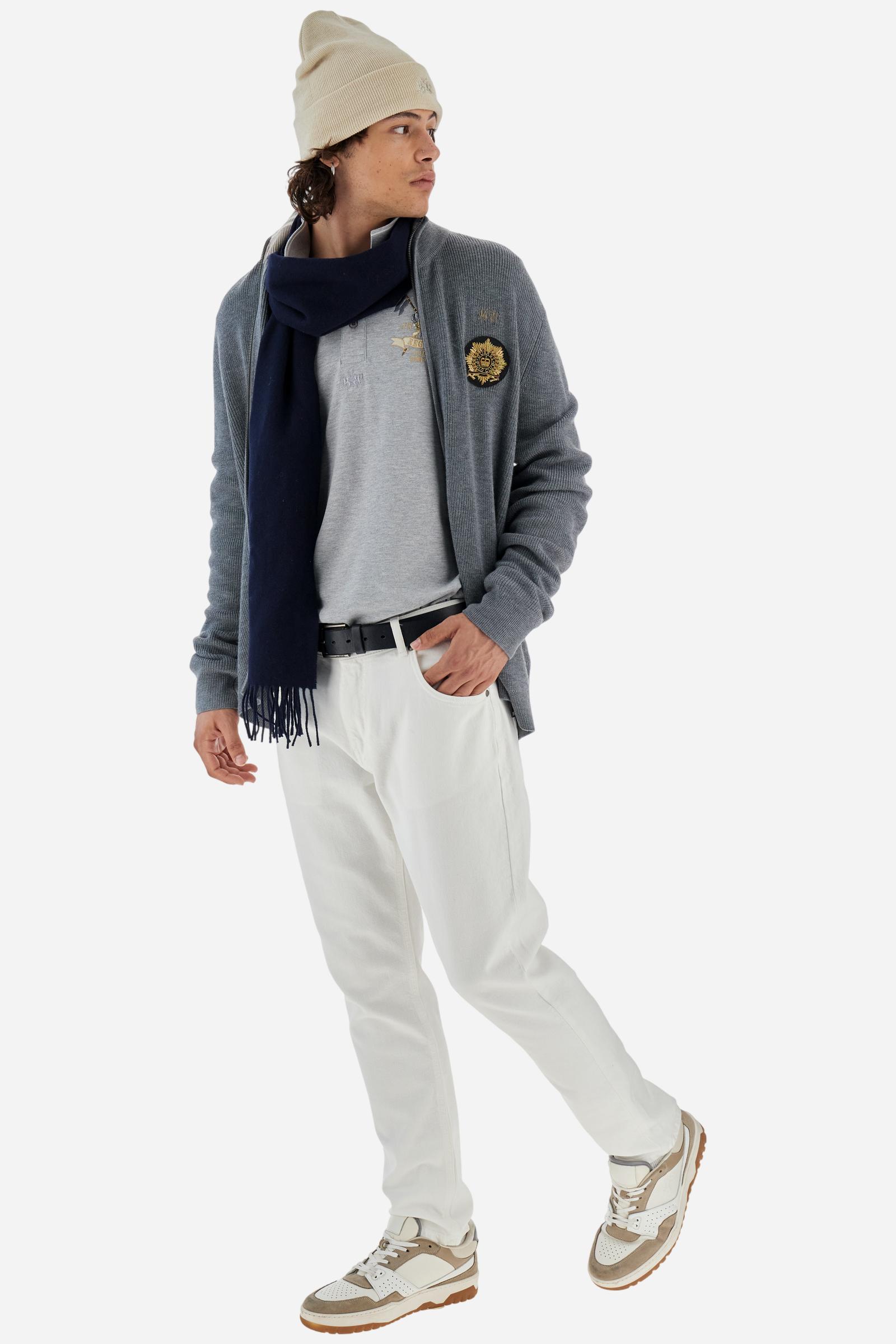 Long-sleeve polo shirt in stretch cotton jersey, soft and breathable. Ribbed collar with contrast striped edge and inner tartan ribbon. A colorful embroidered crest enriches the chest, complemented by a tonal embroidered logo under the placket with two personalized buttons. Regular fit for a versatile, timeless look. Model wears size L. - Light Heather Grey