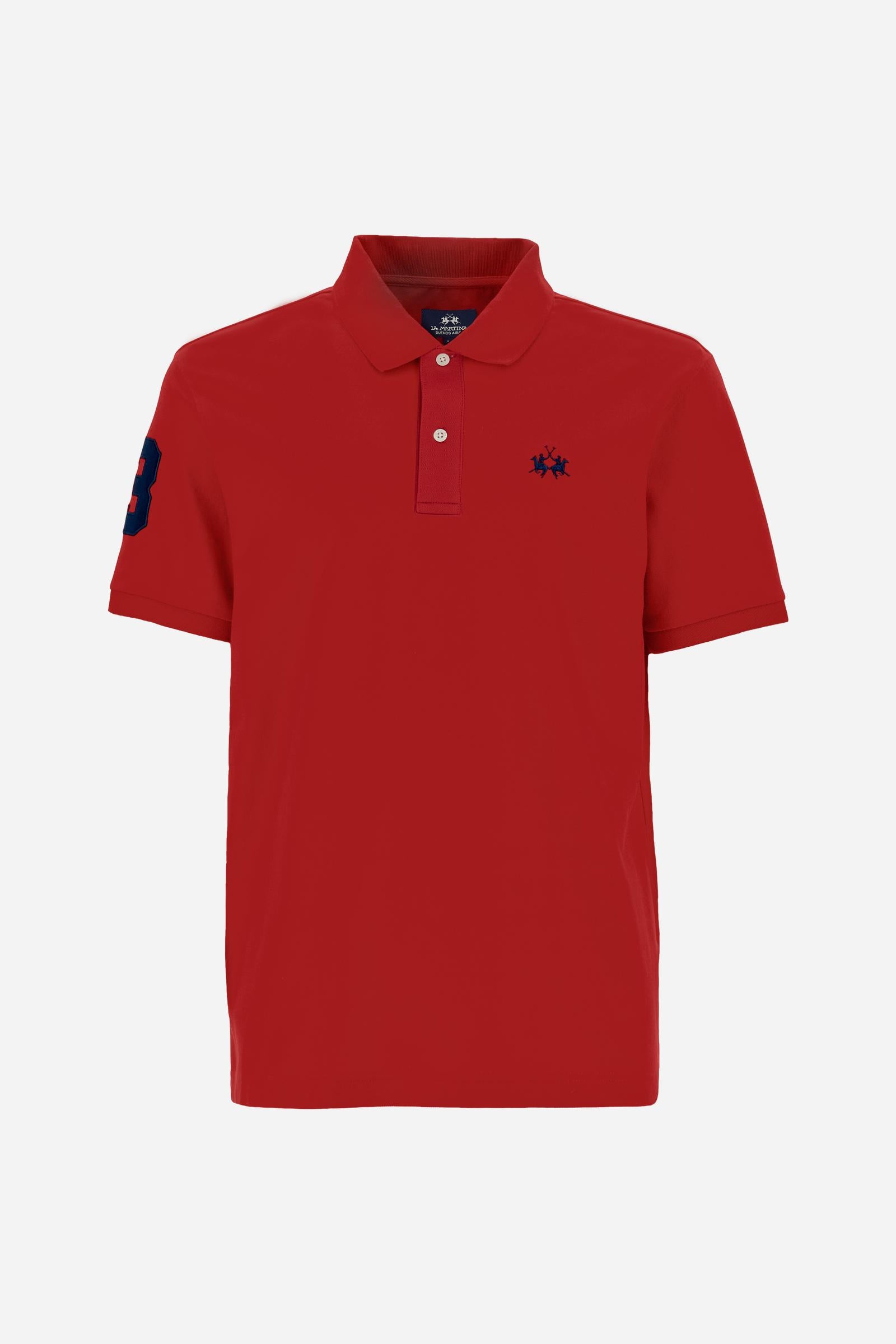 Men’s short-sleeve stretch piqué polo. Two-button placket and ribbed details, with a regular fit. Iconic style characterised by applied logo and patches. - Formula One