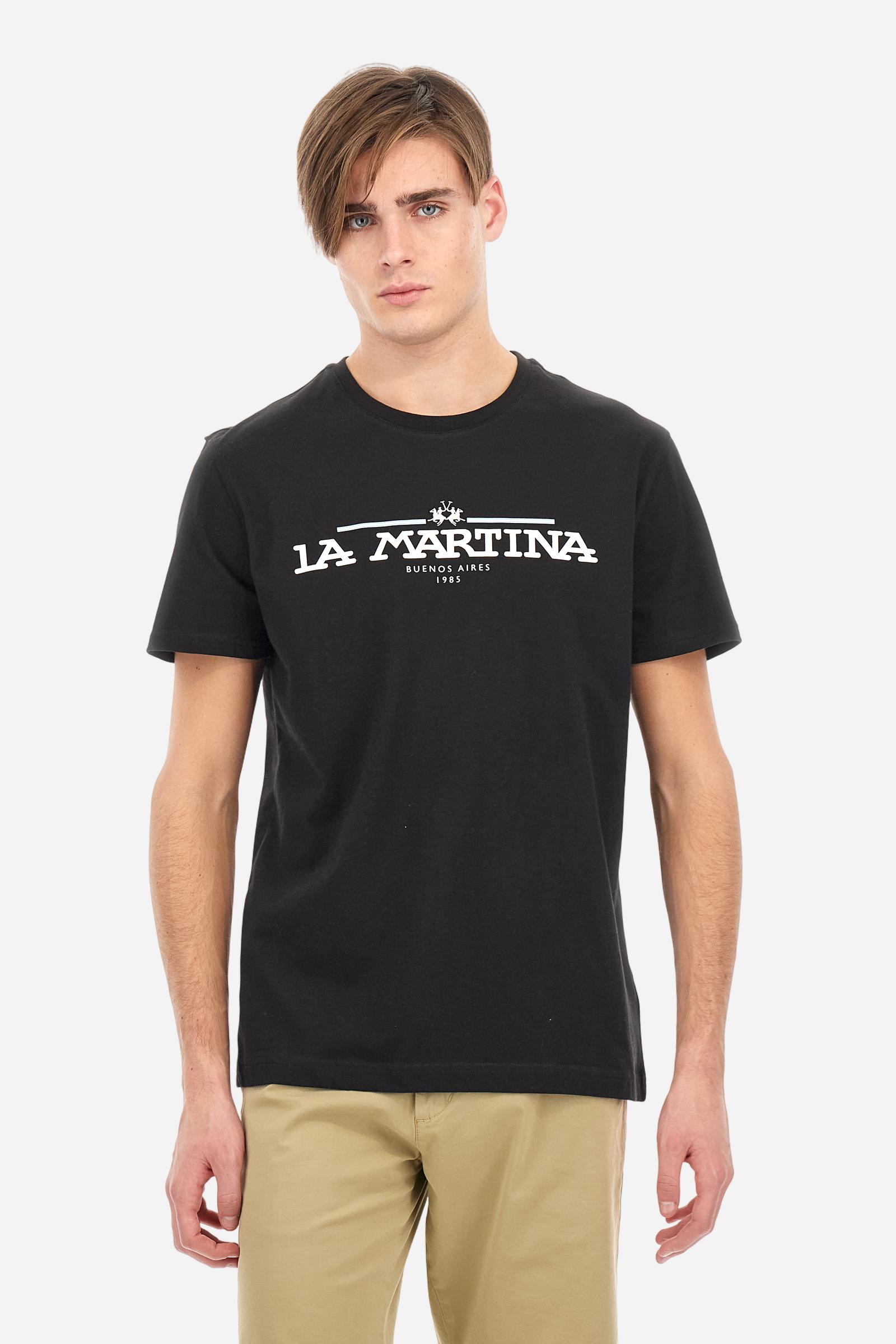 Men's solid color T-shirt, made of cotton jersey. Crew neck. The front features the La Martina text in print. The logo is embroidered on the front, in the center of the chest. The fit is regular. The model is wearing size L. - Black