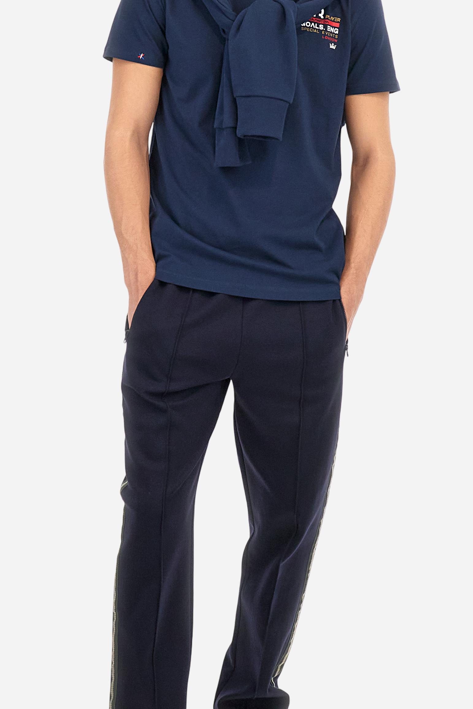 Single-colour short-sleeved men's T-shirt made of cotton jersey. Crew neck, with colour-contrasting jersey border inside. Mlticoloured lettering is printed on the chest, enriched by the embroidered brand logo. The graphics on the back are printed, while the number is a flocked transfer in a contrasting colour. On the right sleeve the small star detail is hand-embroidered with multi-coloured threads. The fit is regular. The model is wearing a size L. - Navy