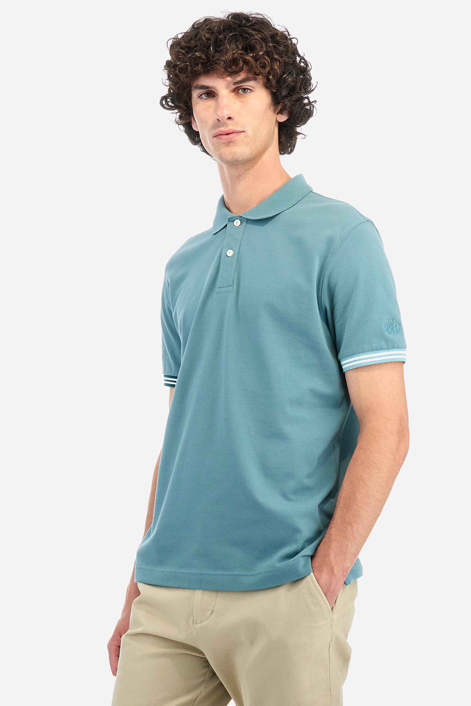 Men's short-sleeved polo shirt in plain stretch cotton. Two-button fastening. The logo is embroidered on one of the sleeves. Regular fit. The model is wearing a size L. - Arctic