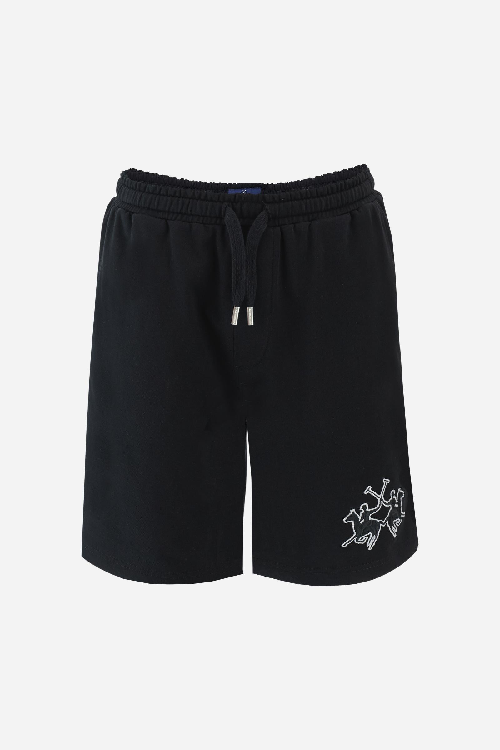Men's bermuda shorts made from soft 100% cotton diagonal fleece. The regular relaxed cut reaches the knee and ensures maximum freedom of movement. The elastic waistband is completed by a flat tone-on-tone drawstring for adjustment. The design is finished with the brand's maxi logo embroidered in contrasting color with a 3D effect on the lower left leg. The model is wearing size L. - Black