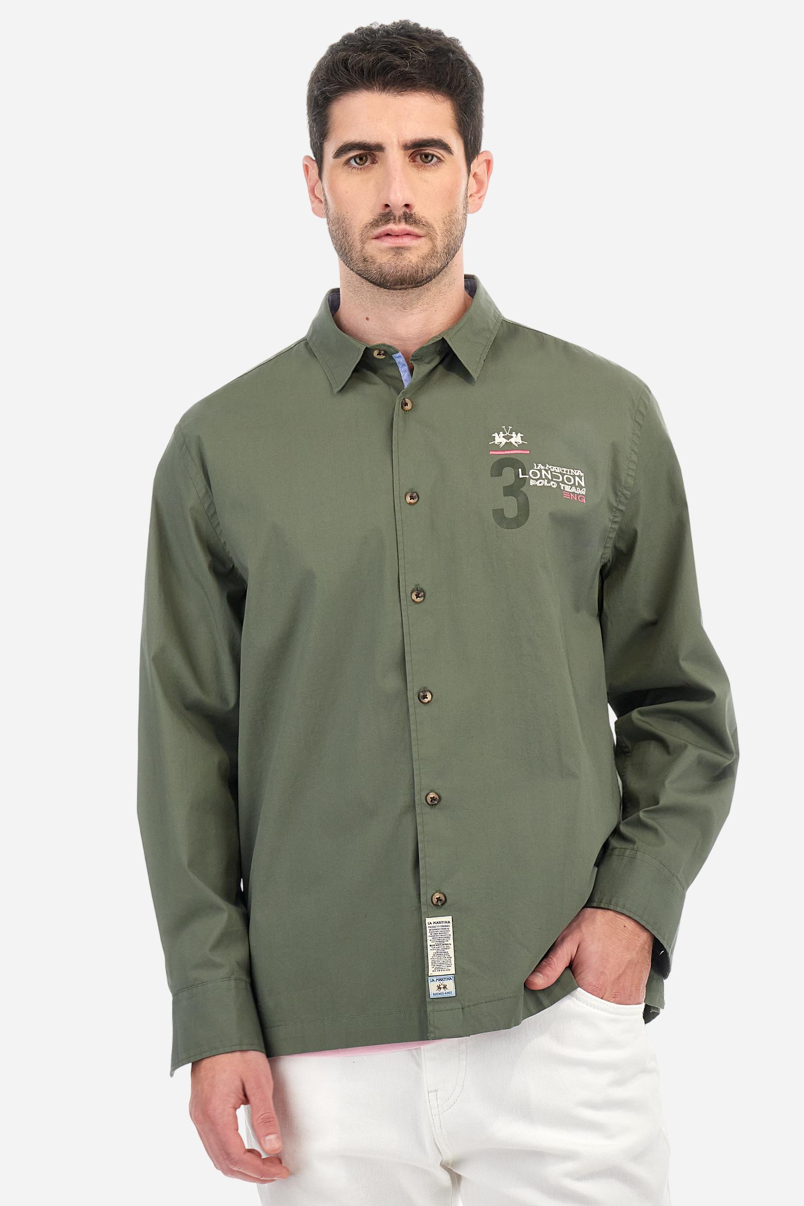 Men's single-colour long-sleeved shirt, made from 100% cotton poplin. Spread collar. Contrasting printed fabric details on the inside of the collar and opening. The numbers on the chest and back graphics are rubberised prints, while the rest of the graphics are embroidered. The logo and La Martina lettering is embroidered on the left chest. The fit is regular. The model is wearing a size L. - Thyme