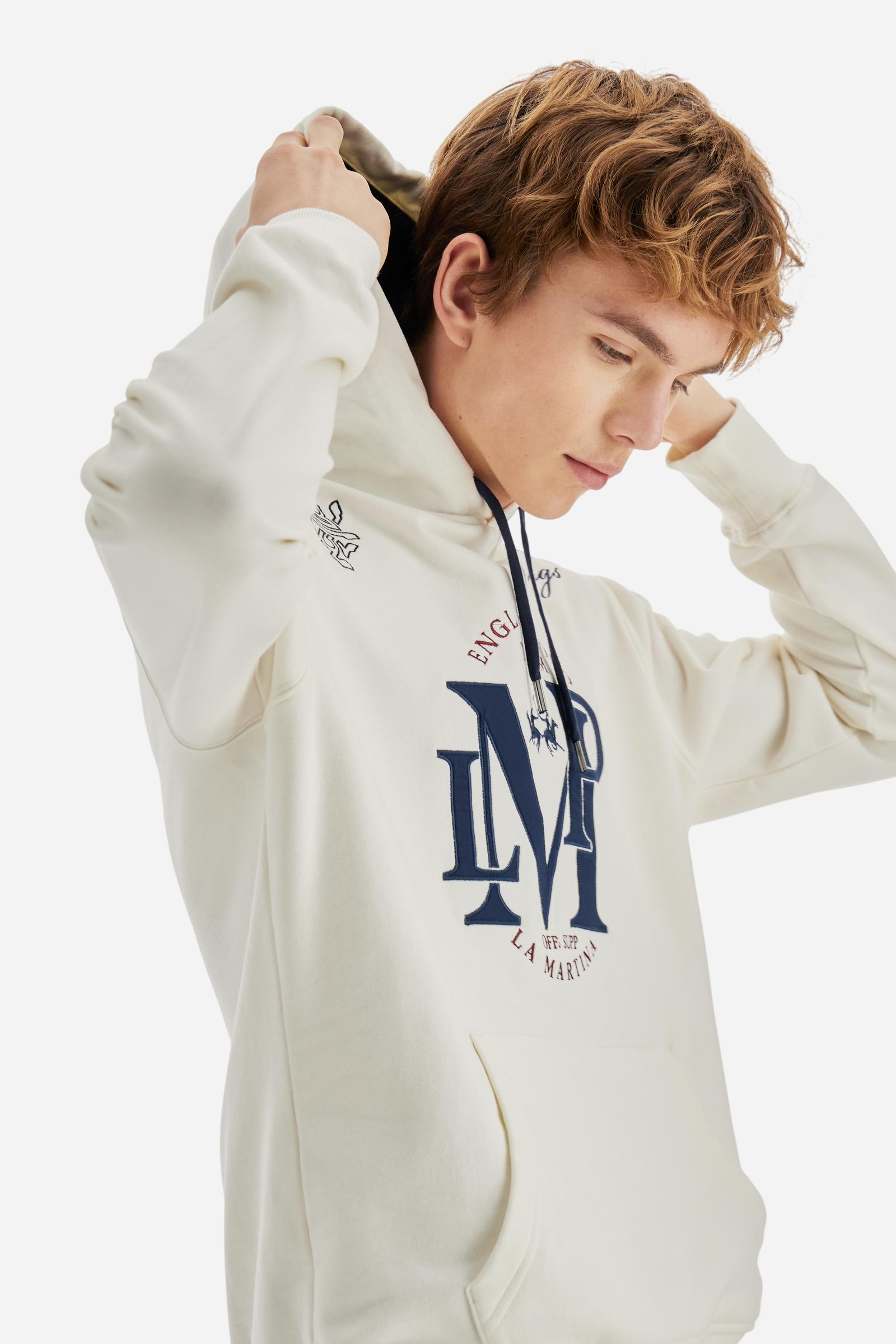 Men's long-sleeved hoodie in solid cotton French terry. Features a large kangaroo pocket, hem and cuffs in tone-on-tone rib. Adjustable hood with contrast lining. Chest and sleeves decorated with modern LM monogram graphics inspired by British polo. Contrasting embroidered logo on the chest. Regular fit for a relaxed and comfortable silhouette. Model wears size L. - Off White