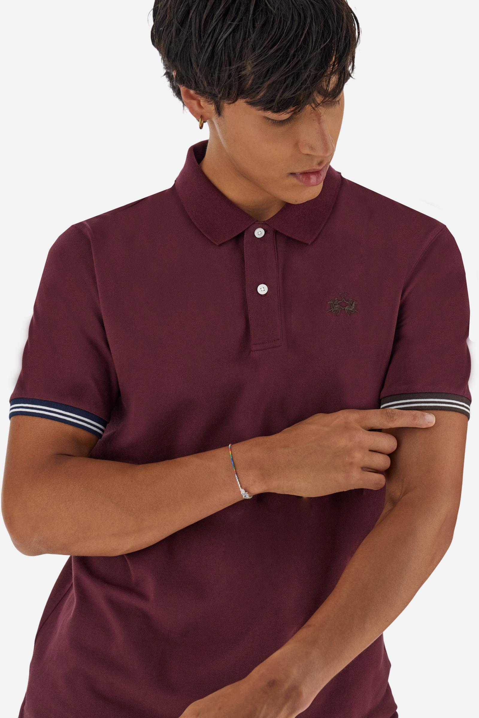 Men’s short-sleeve polo in high-quality stretch cotton piqué, ensuring excellent breathability and flexibility. Classic ribbed collar, two-button placket with customized buttons. Inner collar enriched with contrast tapes and colors for a modern touch. Multicolored ribbed cuffs with different patterns. Small contrast logo embroidered on the chest. Regular fit. Model wears size L. - Port Royale