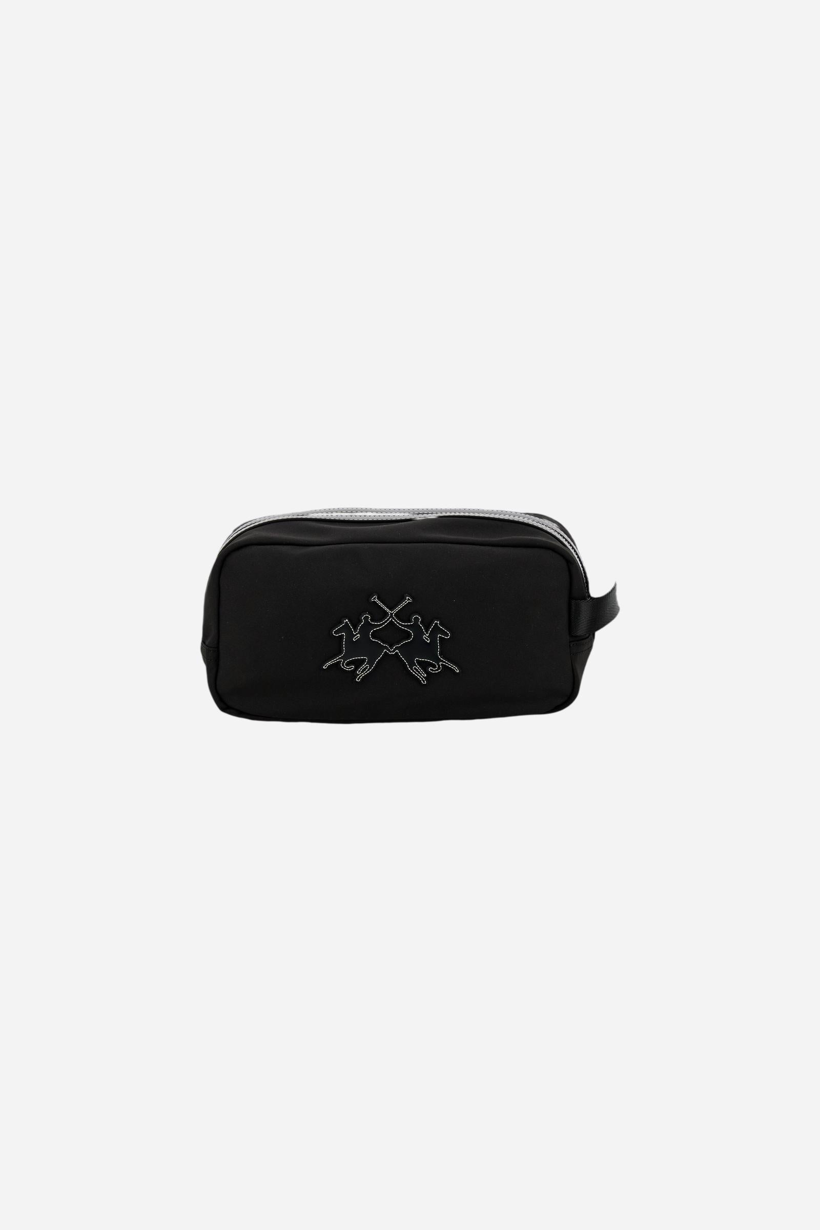 Travel case in matte technical canvas with eco-leather details, double zip compartment and maxi logo on the front. - Black
