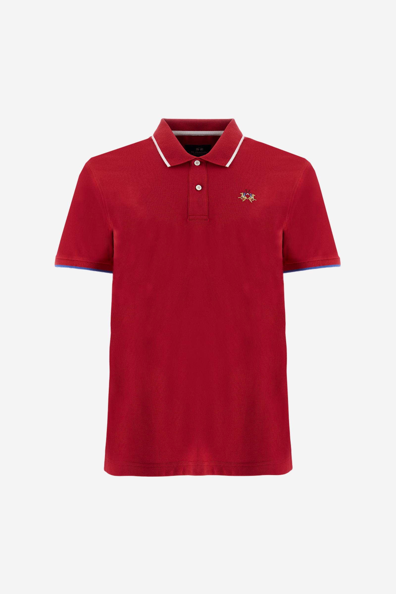 Short-sleeved, single-colour men's polo shirt made of stretch cotton piqué. Fastens with two buttons. The collar and cuffs are ribbed, and there is a colour-contrasting trim at the bottom of the collar. Inside the collar there is a grosgrain ribbon of a different shade. The logo is embroidered on the chest in a contrasting colour. The fit is slim. The model is wearing a size L. - Formula One