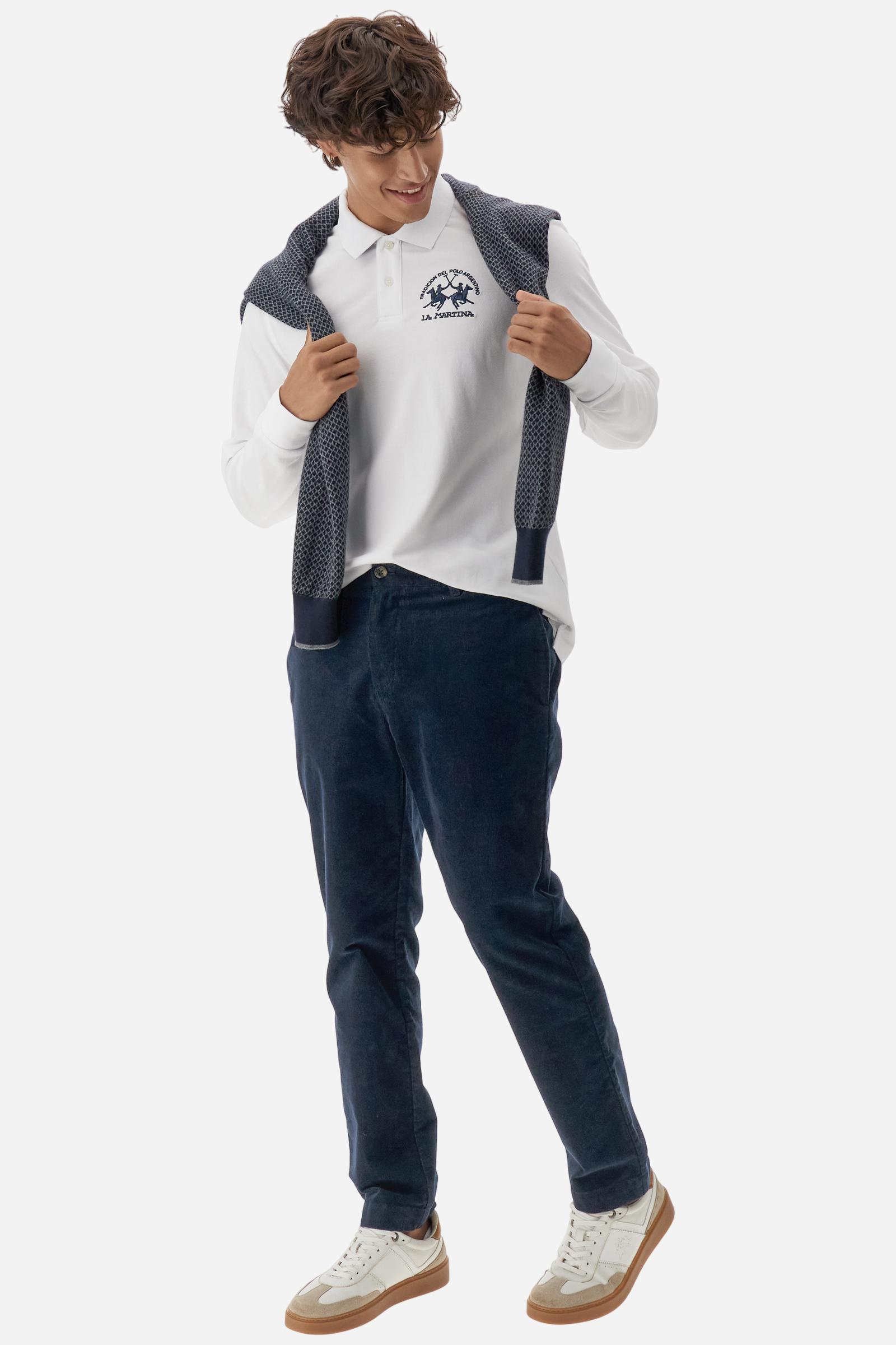 Men's long-sleeved solid colour polo shirt. Made of high-quality stretch Piqué. The collar and cuffs are in solid colour ribbing. The undercollar features a print of the iconic La Martina lettering in a contrasting colour. Featuring a logo embroidered on the chest in a contrasting colour. On the back at the bottom, the guarantee label typical of the brand's iconic models is applied. Regular fit. The model is wearing a size L. - Optic White