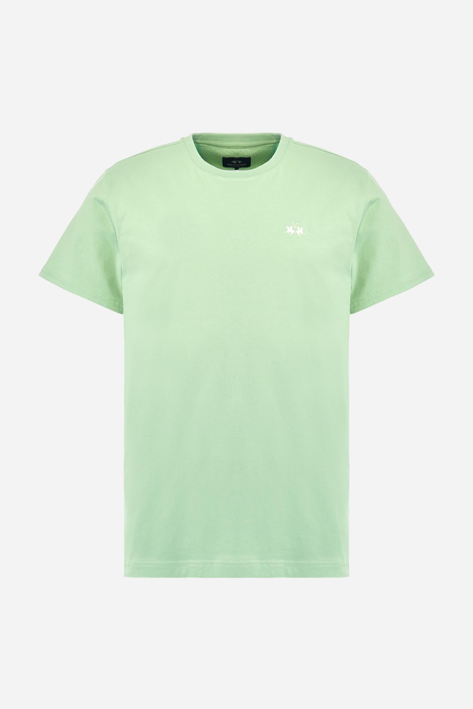 Men's short-sleeved crew-neck T-shirt in solid colour with embroidered logo in contrasting colour on the chest. Made of 100% cotton with a regular fit. It is perfect paired with Bermuda shorts or trousers for a casual and trendy look. Suitable for leisure time. The model is 187 cm tall and wears a size L. - Pastel Green