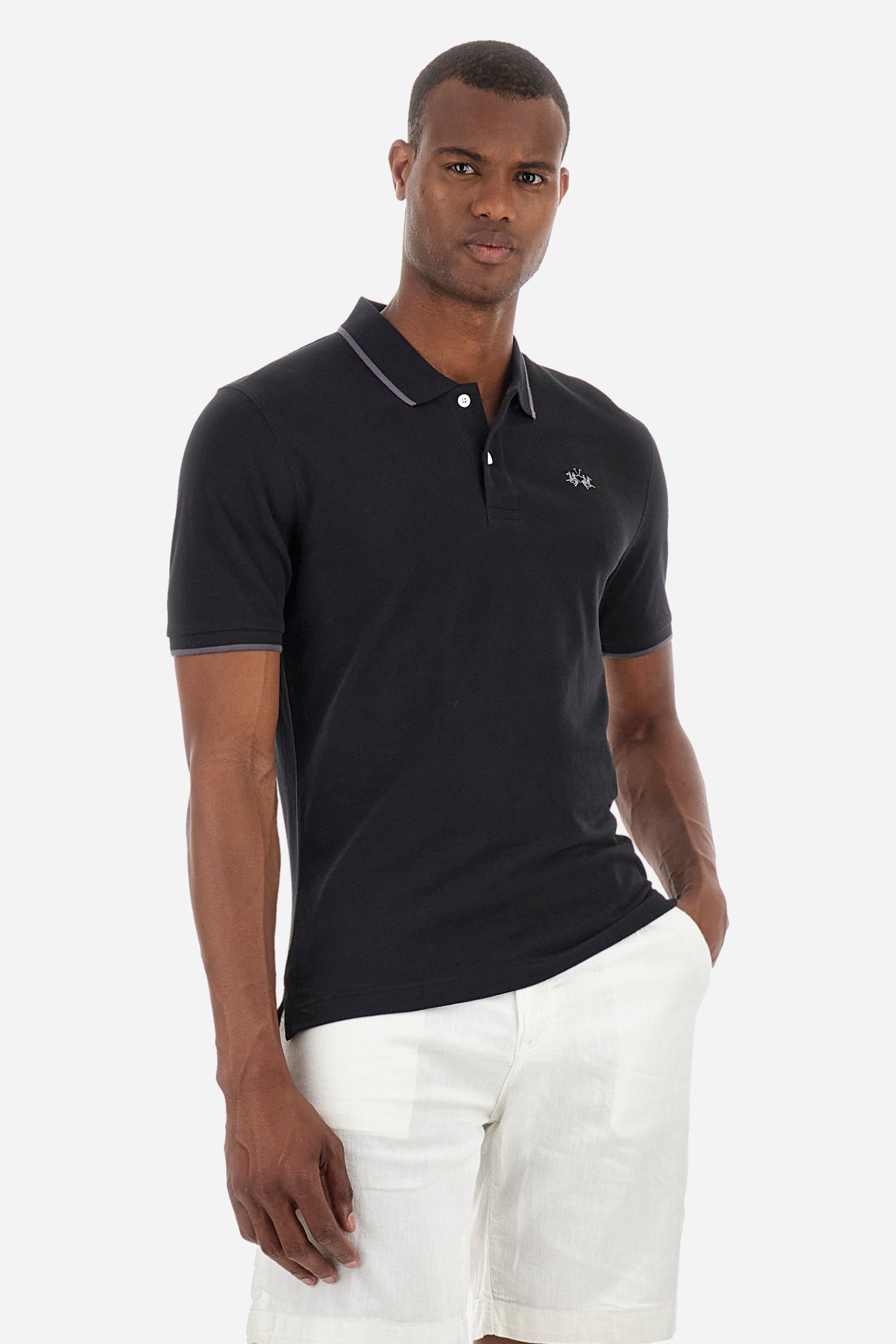 Men’s polo with short sleeves in stretch pique cotton. A classic La Martina, with a simple and linear style. The regular fit fits easily to any type of silhouette. A small La Martina logo is embroidered on the chest, in contrasting shades like the sleeve edge. The model is 187 cm tall and wears a size L. - Black