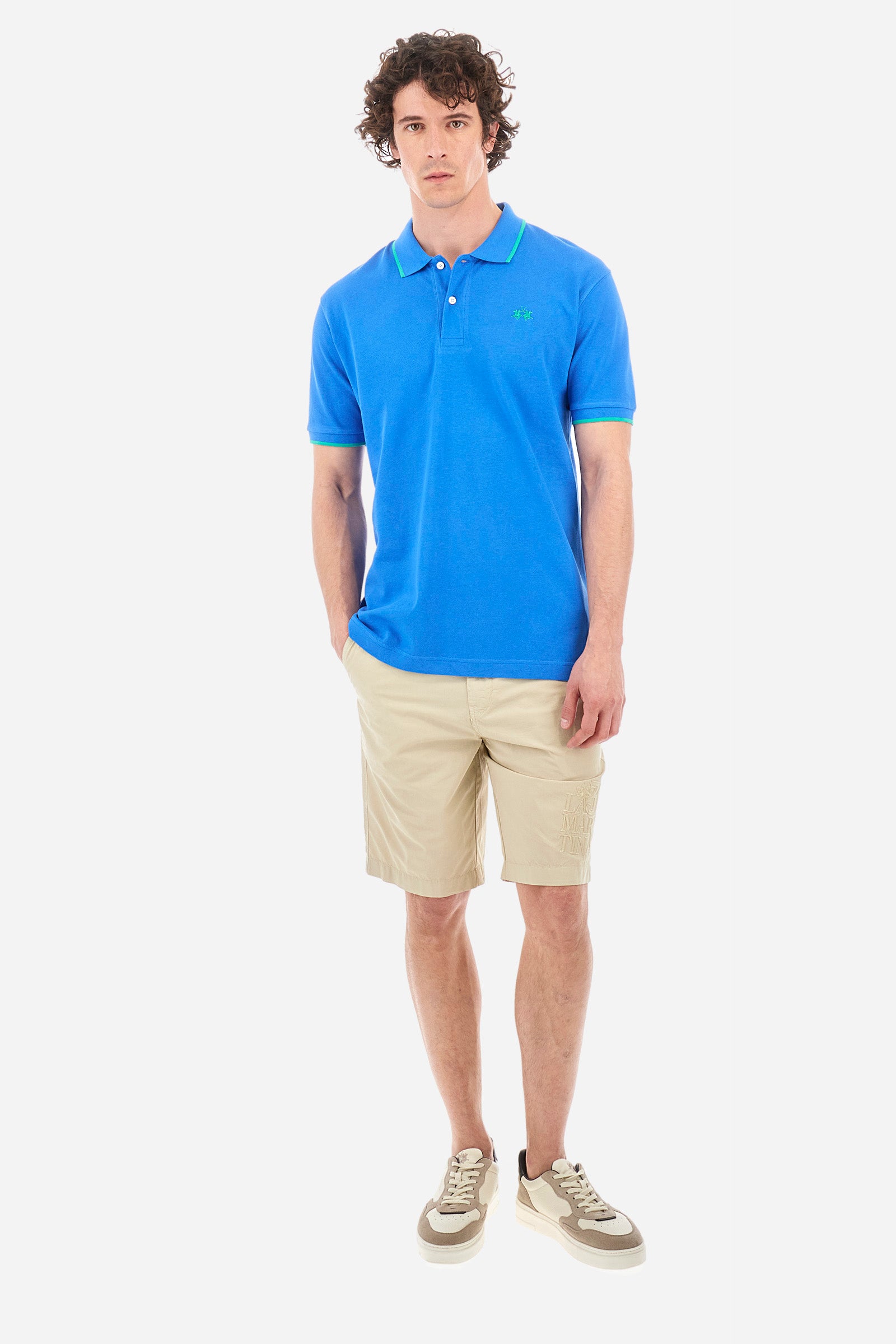 Men’s polo with short sleeves in stretch pique cotton. A classic La Martina, with a simple and linear style. The regular fit fits easily to any type of silhouette. A small La Martina logo is embroidered on the chest, in contrasting shades like the sleeve edge. The model is 187 cm tall and wears a size L. - Campanula