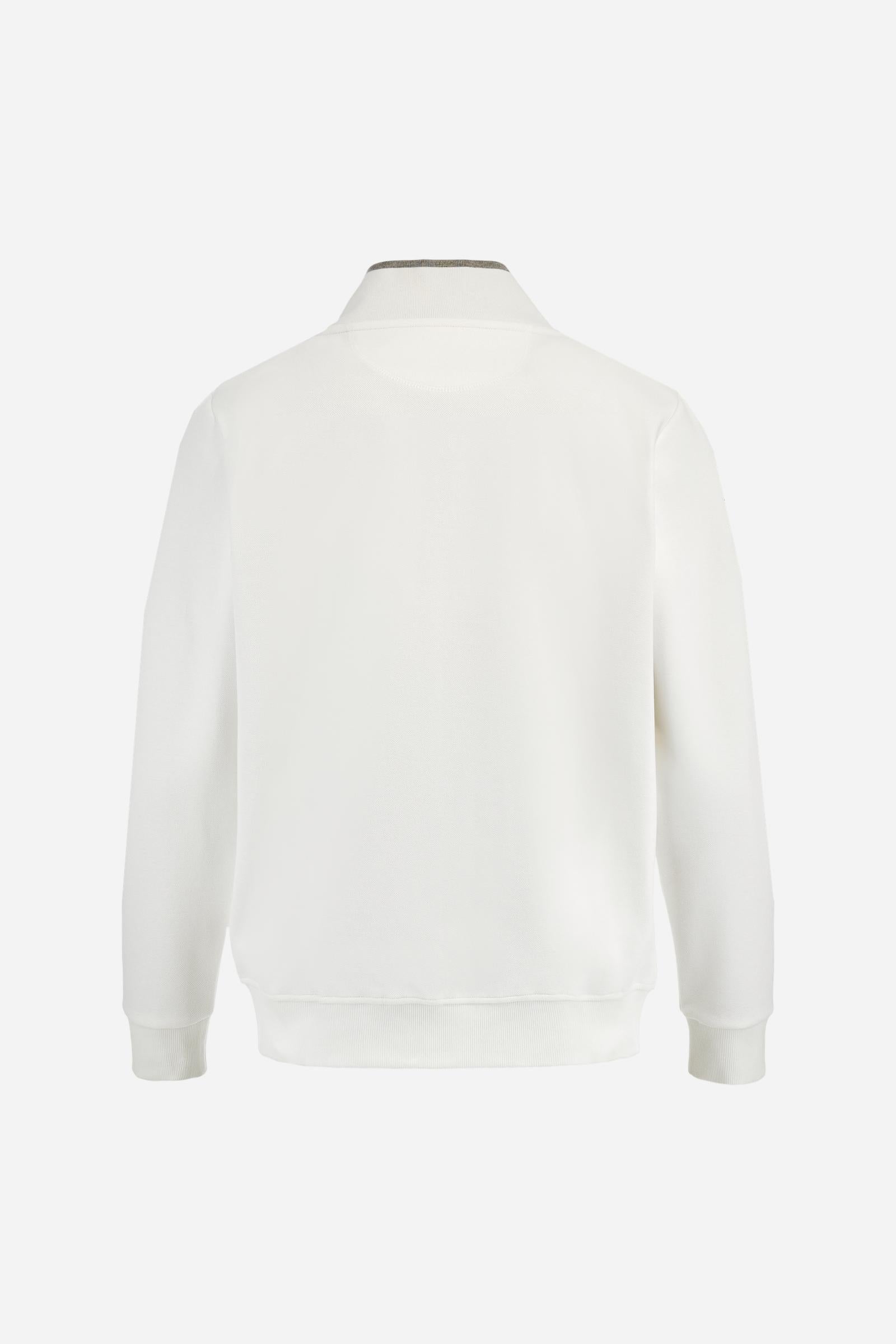 Men's long-sleeved, full-zip solid colour sweatshirt. Made of stretch cotton-blend piqué. Design with front opening fastened by a zip, high collar in two-tone ribbing. Solid colour ribbed cuffs and waistband. The small brand logo and Guards crest are embroidered in multi-coloured thread on the chest. On the right sleeve, there is another embroidery of a crest inspired by the British royal household. The regular fit silhouette is practical for everyday wear. The model is wearing a size L. - Off White