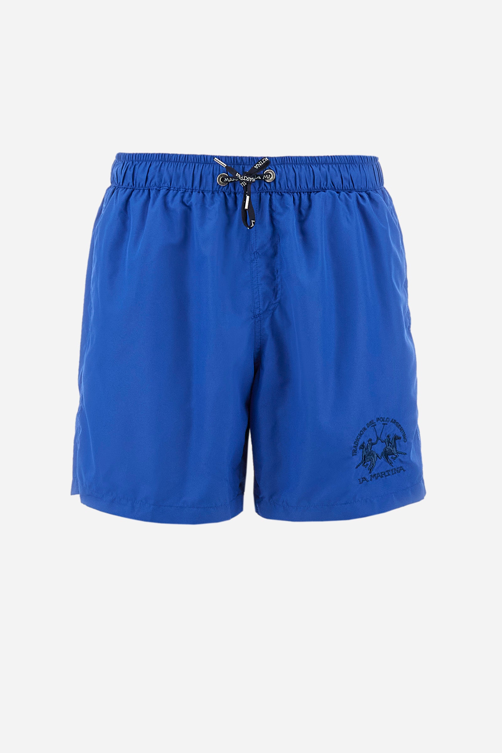 Single-colour men's swimming shorts, made of synthetic fabric. Featuring a drawstring and tie with "La Martina" lettering. Double welt pocket on the front. Closed pocket on the back. Mesh lining. Large logo embroidered on the front. The fit is regular. The model wears a size L. - Olympian blue