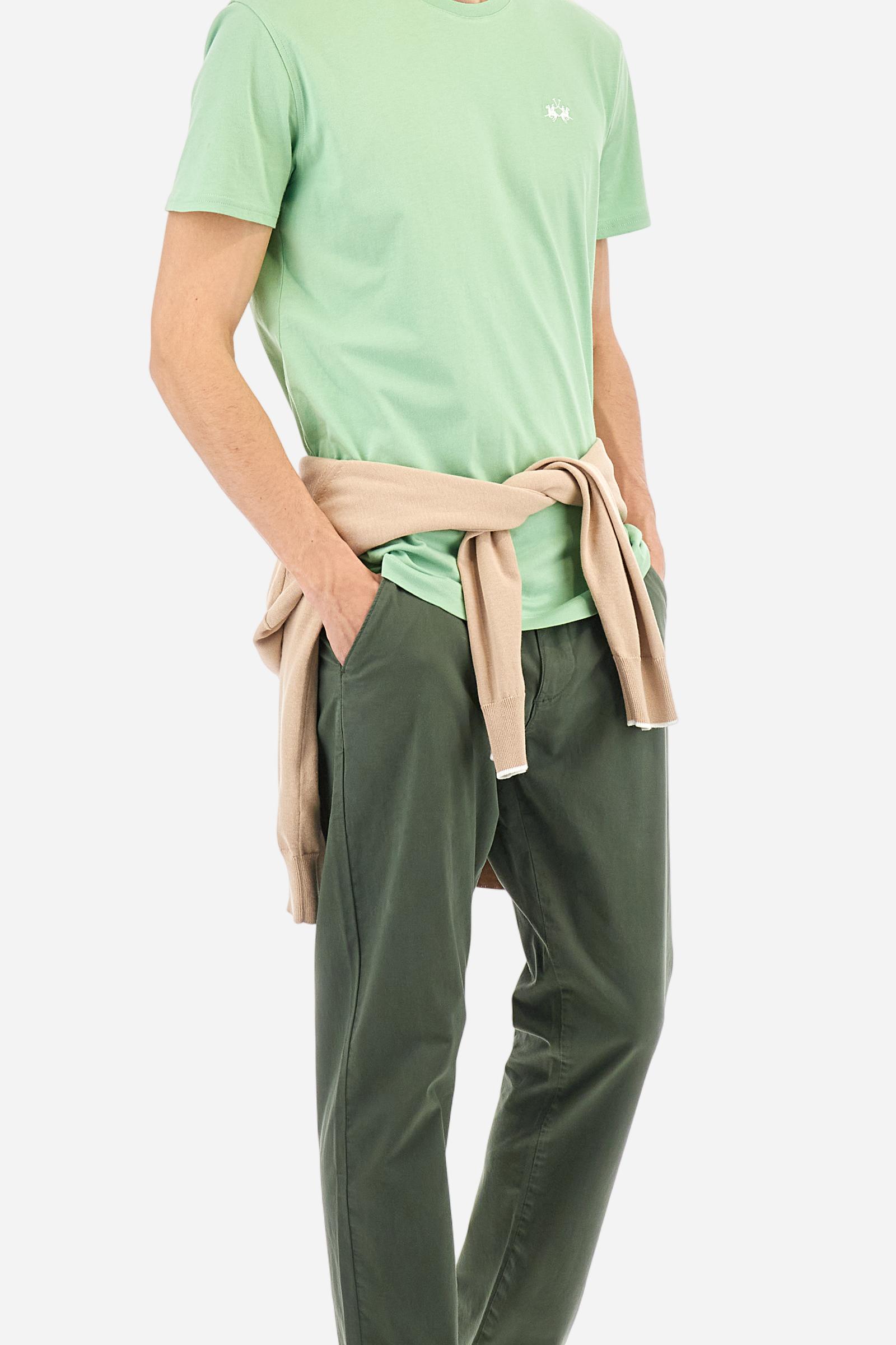 Men's short-sleeved crew-neck T-shirt in solid colour with embroidered logo in contrasting colour on the chest. Made of 100% cotton with a regular fit. It is perfect paired with Bermuda shorts or trousers for a casual and trendy look. Suitable for leisure time. The model is 187 cm tall and wears a size L. - Pastel Green