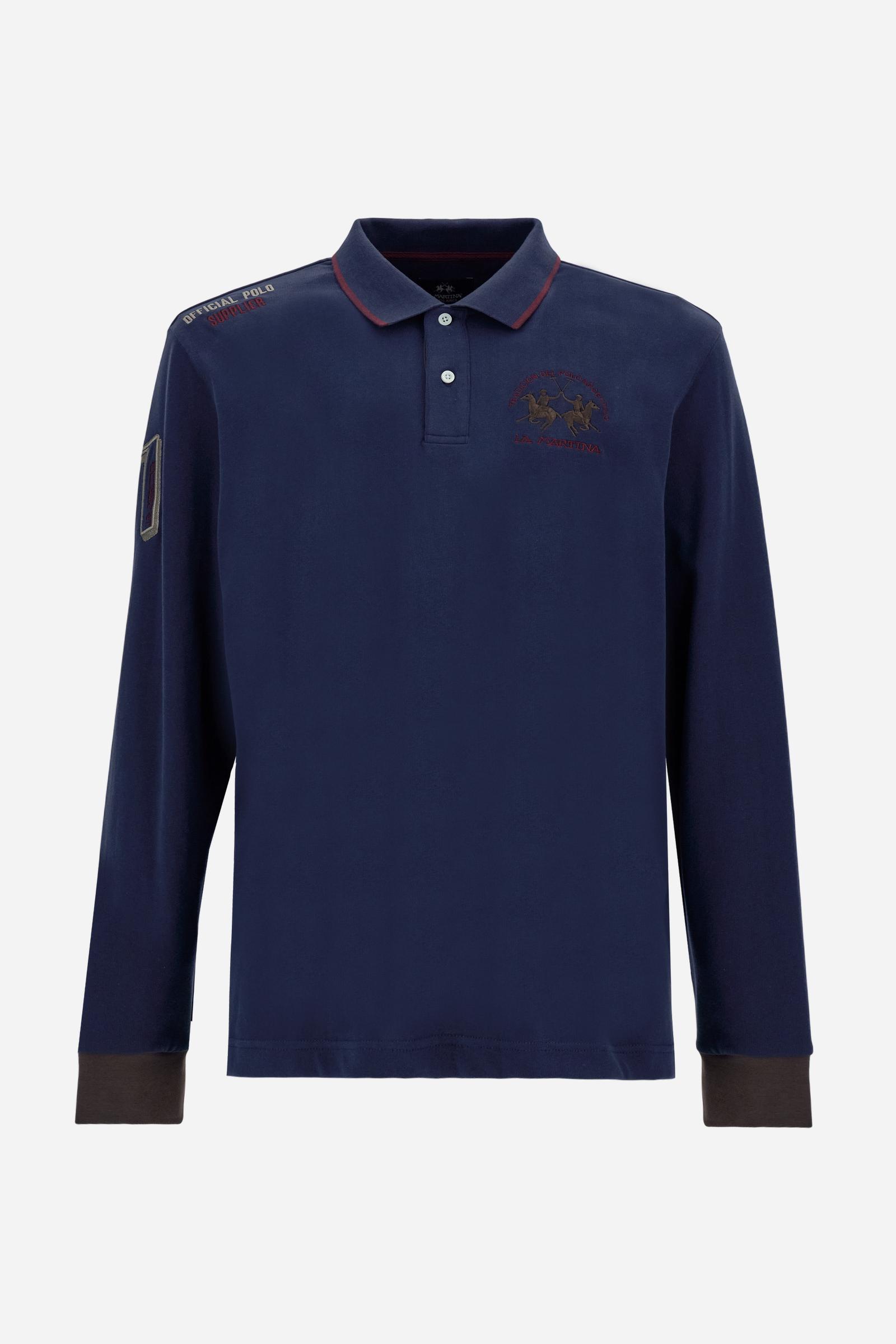 Men’s long-sleeve polo shirt in solid-colour cotton jersey with a warm, matte handfeel. Ribbed collar and cuffs with stripes and colour blocks in contrast, two personalised buttons and contrast details inside the collar. Patches and graphics on sleeves and chest celebrate the Official Polo Supplier team. The large multicolour logo is embroidered on the chest. Regular fit. The model wears size L. - Navy
