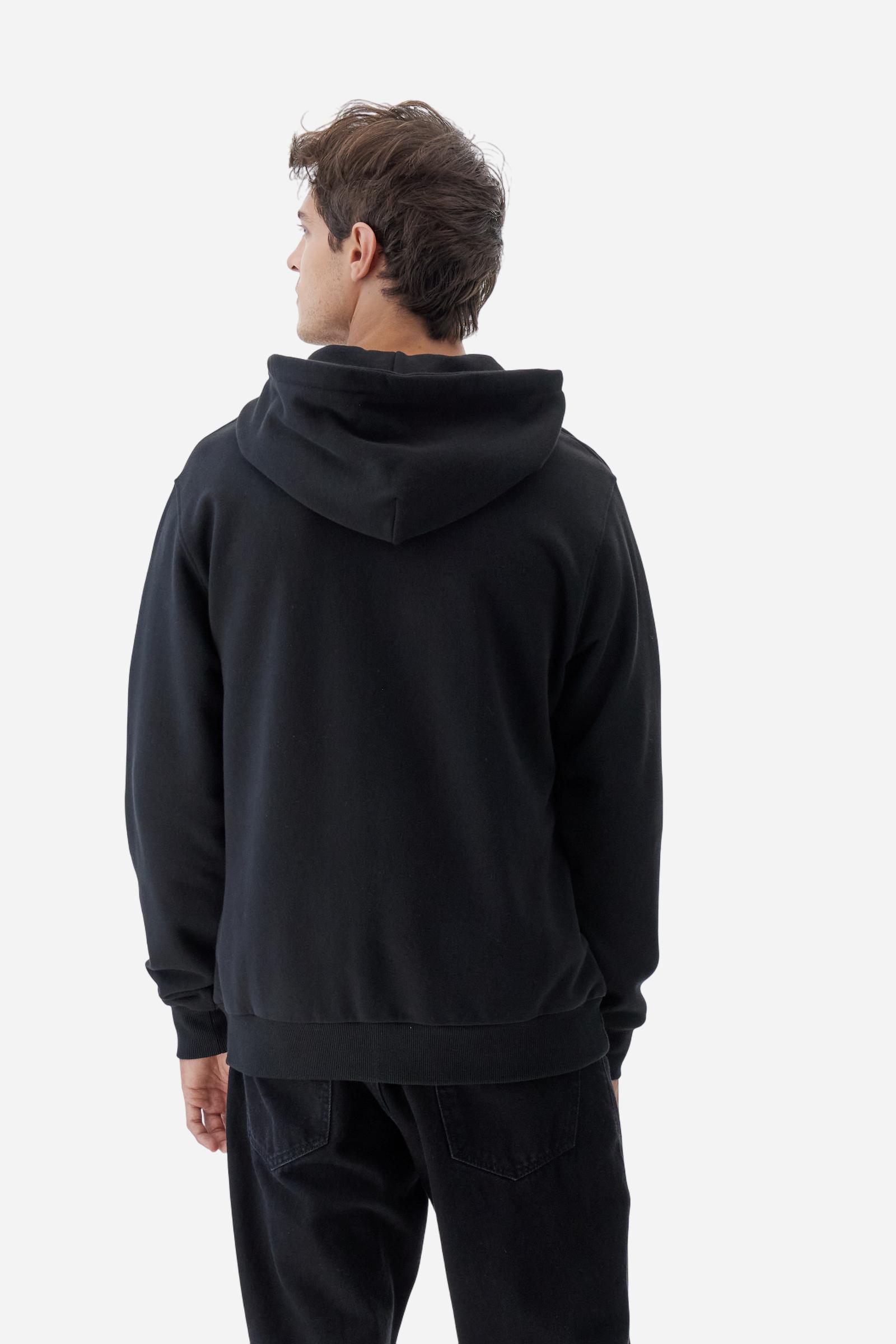 Men's long-sleeved hoodie in solid colour, made from soft 100% cotton fleece with a velvety touch. The model features a customised front zip and an adjustable hood with drawstring. Hem and cuffs in tone-on-tone rib. Iconic brand graphics stand out on the chest, embroidered with numbers and lettering. Regular fit ensuring comfort and freedom of movement. Model wears size L. - Black