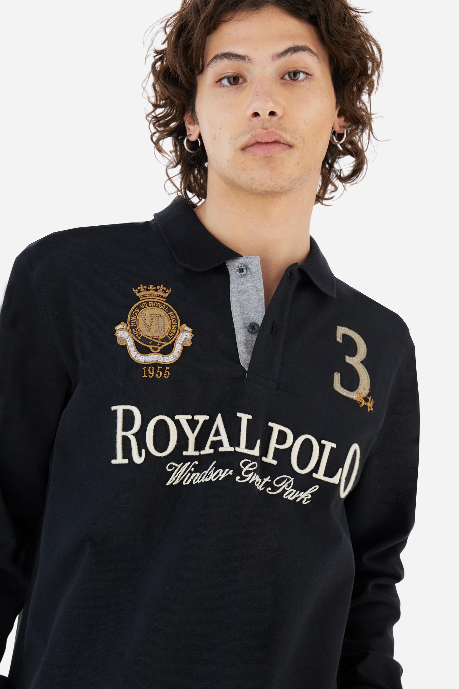 Men's long-sleeved solid colour, cotton jersey polo shirt. Two-button opening with contrasting details. Solid colour ribbed collar and cuffs. The chest features embroidered crests and lettering inspired by British royal heritage. The number 3 features on a patch with a fringed edge. The small brand logo is embroidered next to the number in contrasting colour. Regular fit. The model is wearing a size L. - Black