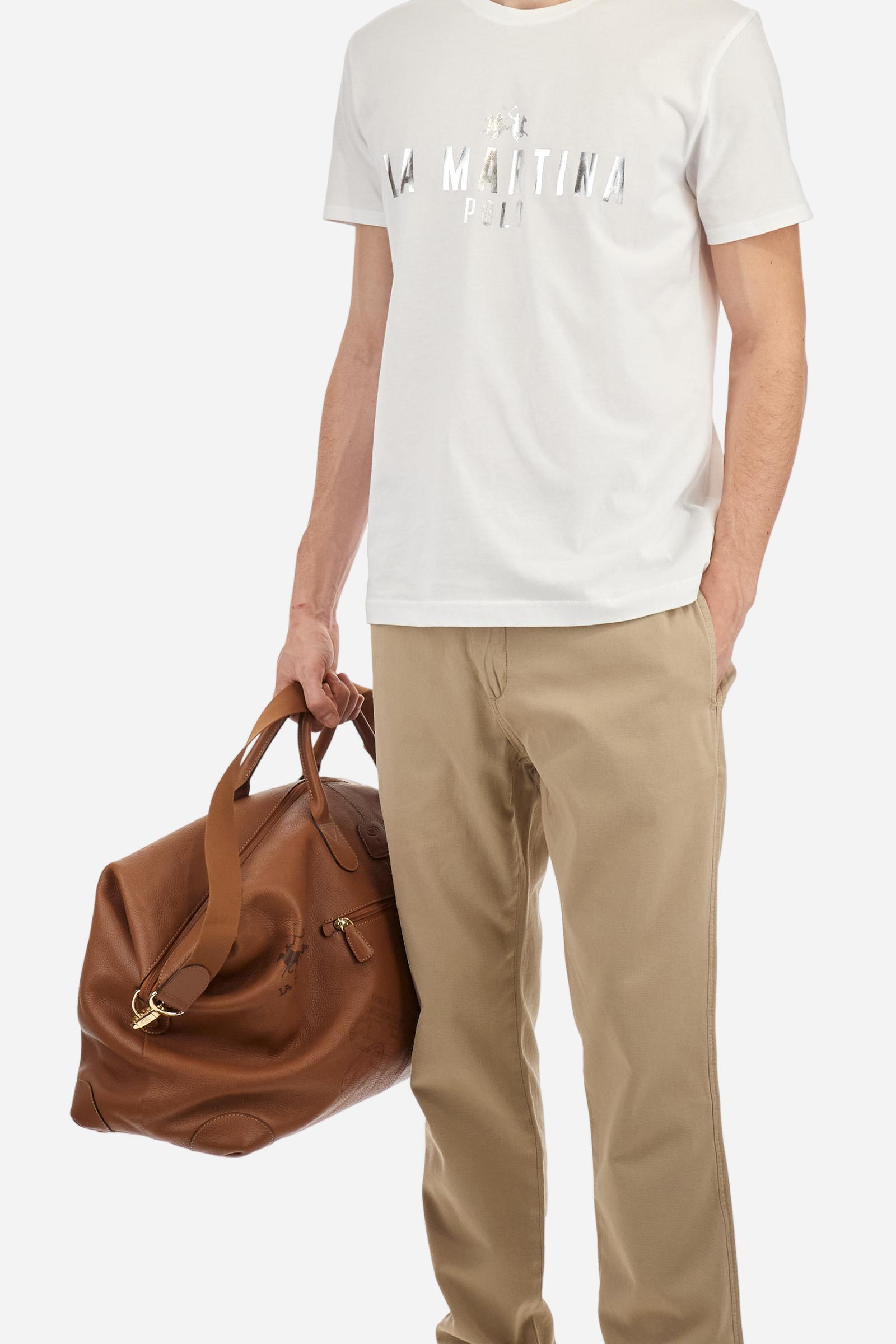 Men's single-colour crew-neck T-shirt with short sleeves, made of 100% cotton. The front features a printed logo and the lettering La Martina Polo. The number 3 is printed on one of the sleeves. Regular fit. The model is wearing a size L. - Optic White