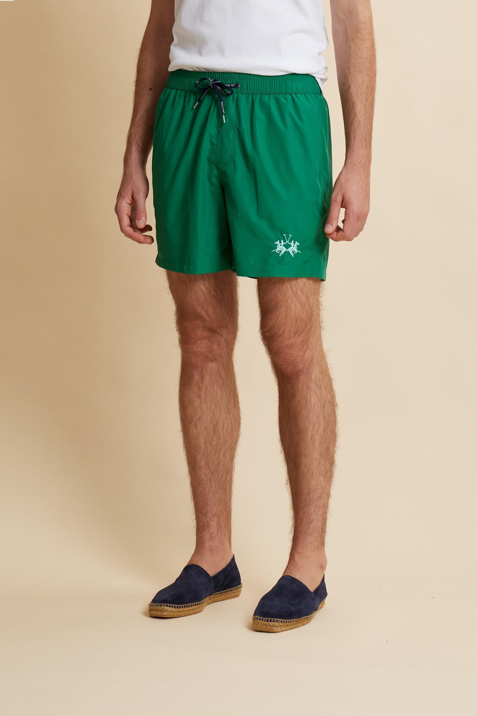 Men’s solid nylon mid-length swim shorts. Regular fit with elasticated waistband, adjustable drawstring, back pocket and embroidered logo. - Amazon