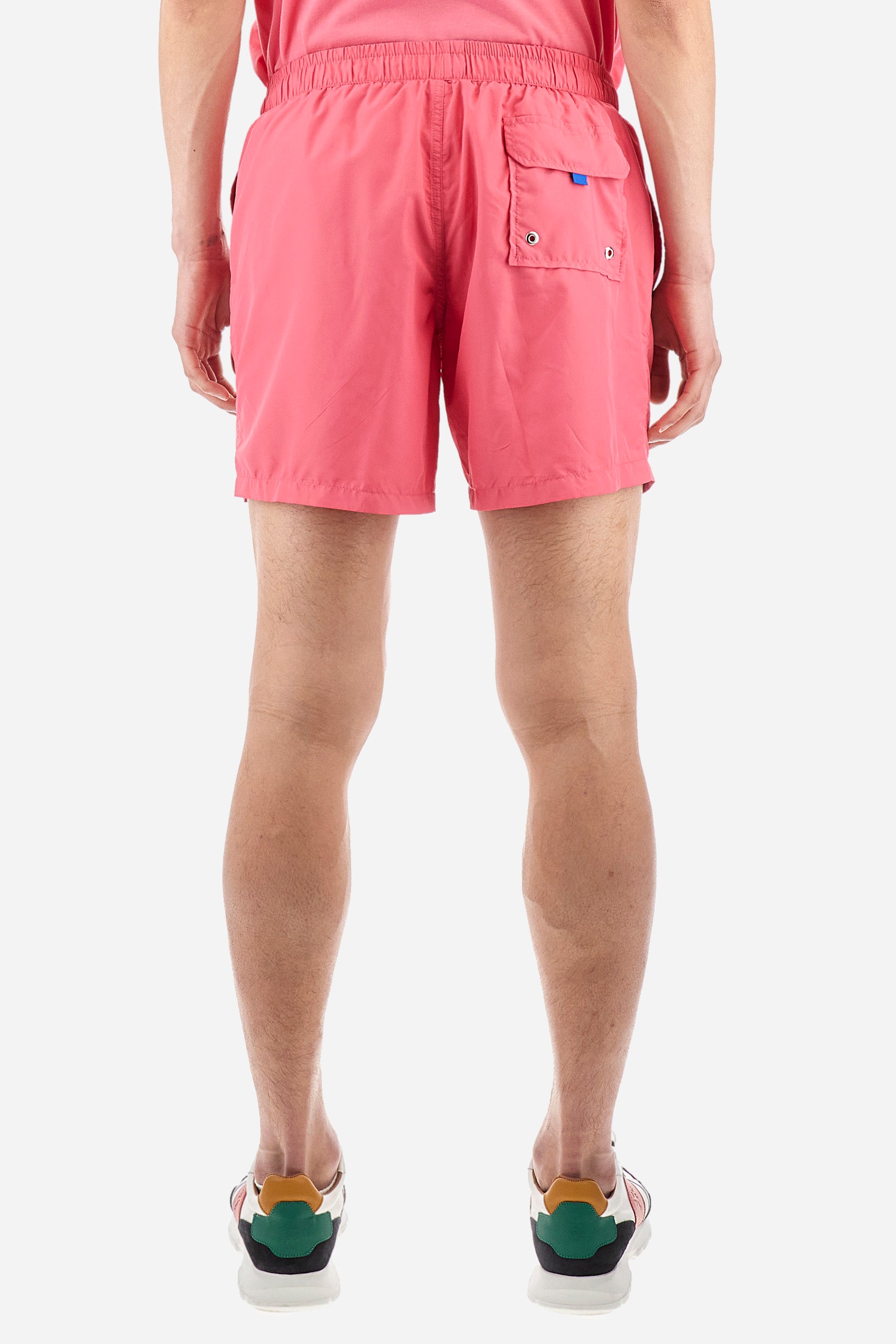Single-colour men's swimming shorts, made of synthetic fabric. Featuring a drawstring and tie with "La Martina" lettering. Double welt pocket on the front. Closed pocket on the back. Mesh lining. Large logo embroidered on the front. The fit is regular. The model wears a size L. - Hot Pink