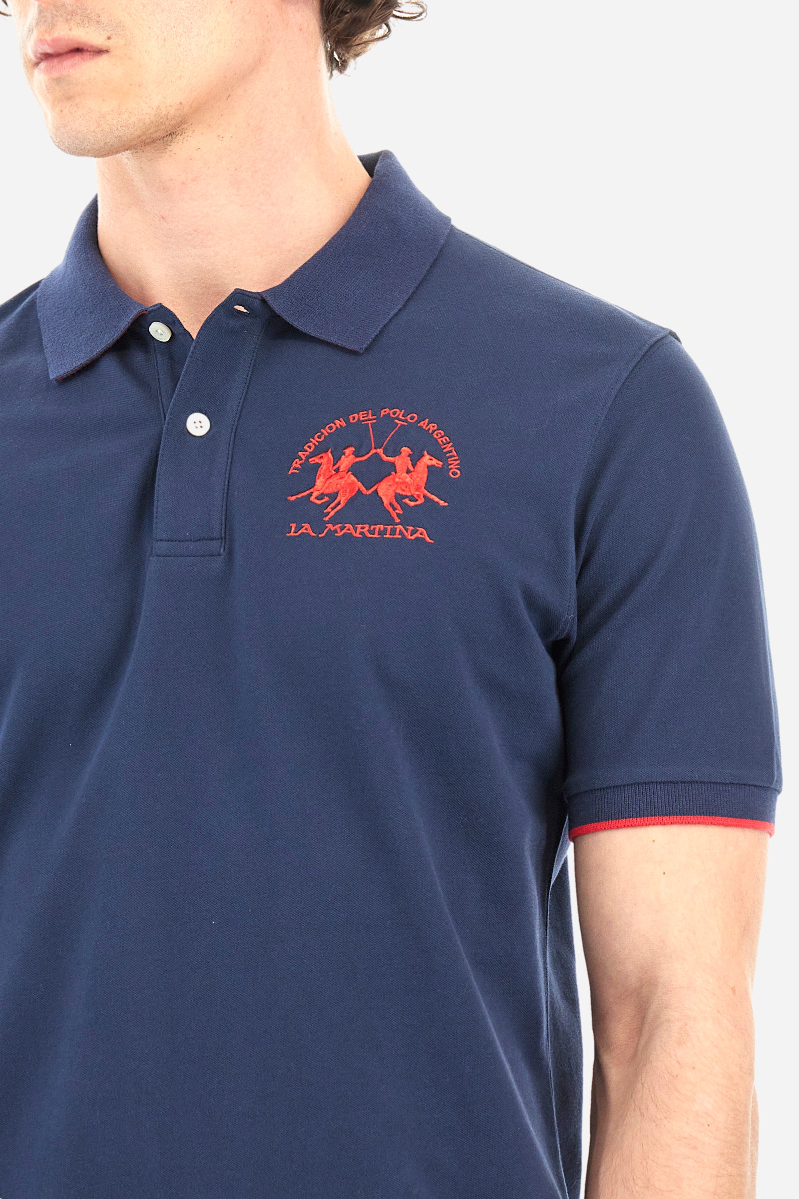 Men's short-sleeved, regular-fit polo shirt. A classic model with a contrasting La Martina logo-embellished chest and profiled sleeve trims. Perfect when worn with a pair of jeans from the collection. - Navy
