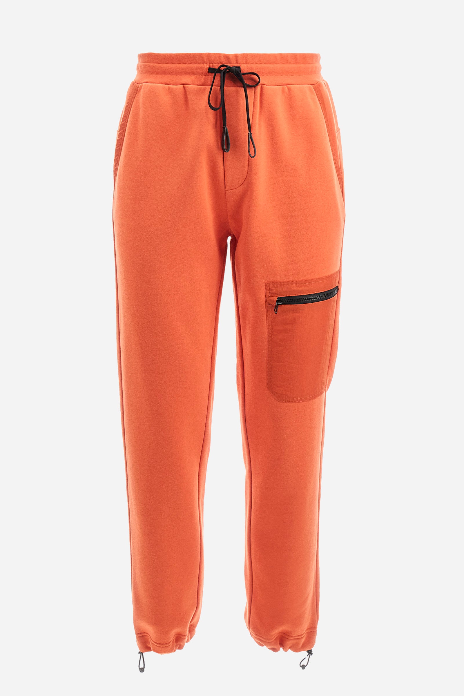 Men's plain jogging bottoms, made from a cotton blend. Drawstring waist and cuffs. Double front pocket. There is an additional zipped pocket on the front. The logo appears on an appliquéd plaque the back. Regular fit. The model is wearing a size L. - Pureed Pumpkin
