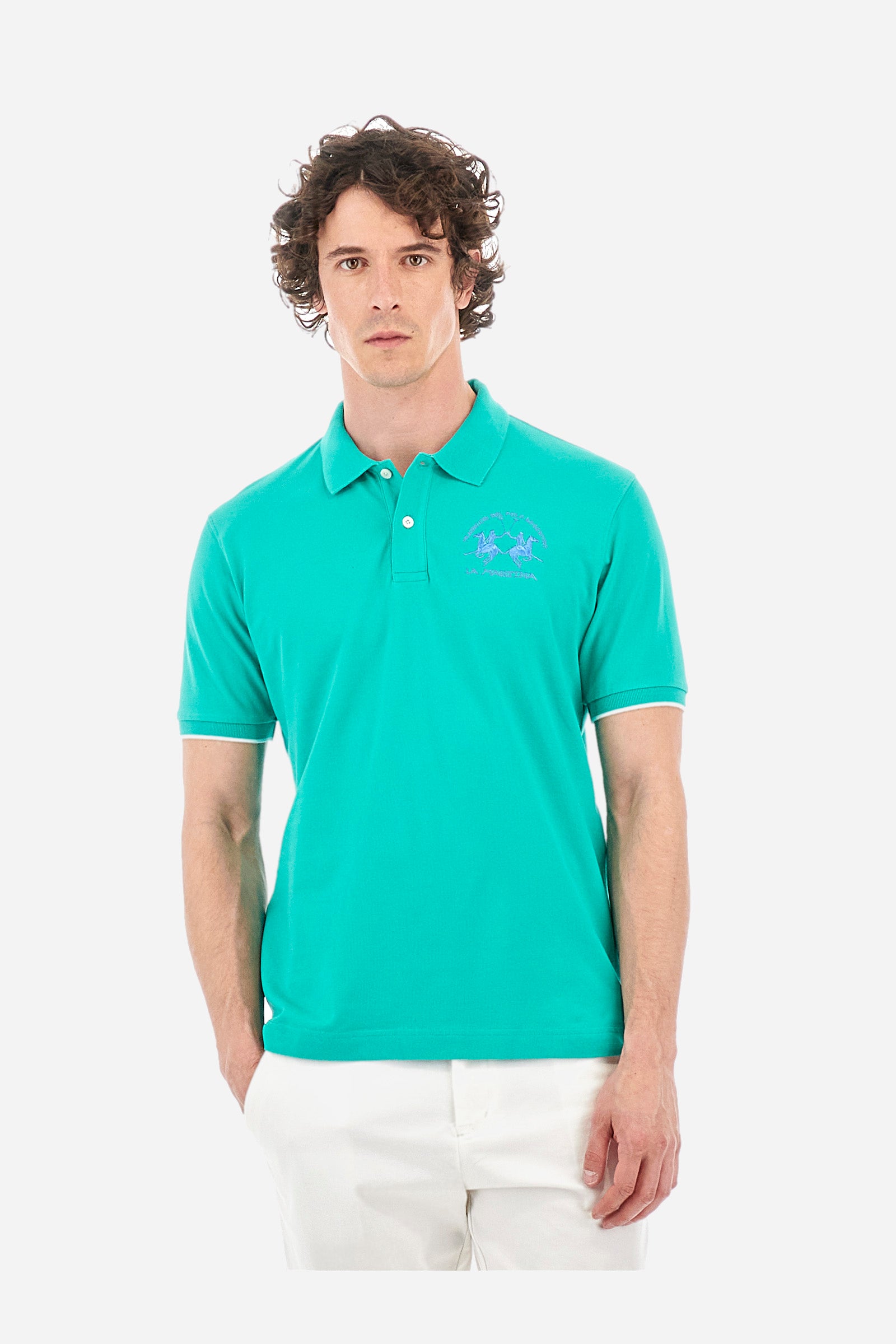 Men’s polo with short sleeves, regular fit. Made of stretch pique cotton. Classic model, with large embroidered logo in contrasting tone on the chest and profiled sleeve edges. The collar is accompanied by the writing La Martina, in contrasting tone. Ideal if worn with a denim collection. The model wears a size L. - Vivid Green