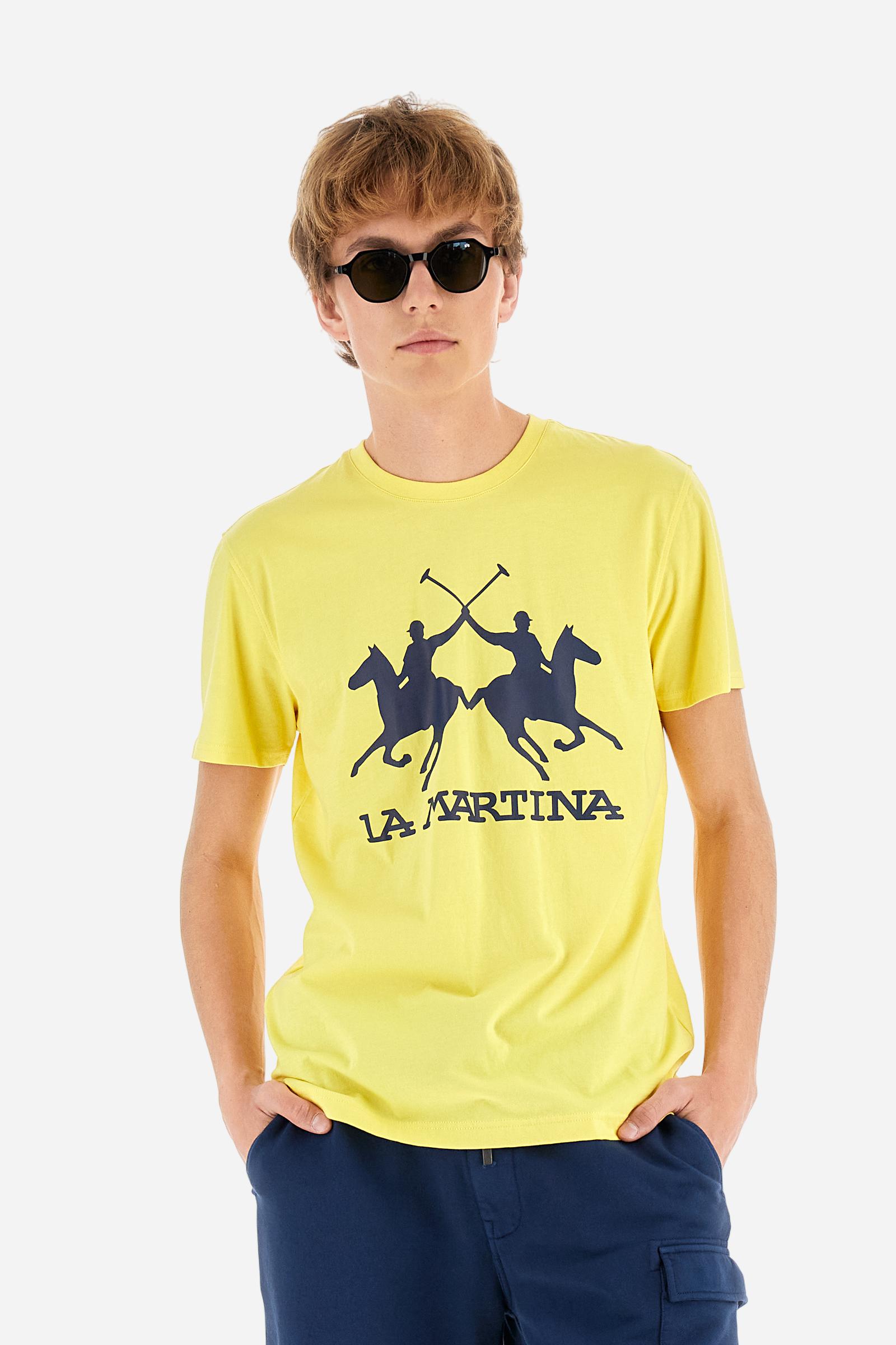 Men's short-sleeved T-shirt with crew neck and solid colour. It features a large printed logo on the front and is made of 100% cotton with a regular fit. It can be combined with trousers for a casual and modern look. The model is 187 cm tall and wears a size L. - Aurora