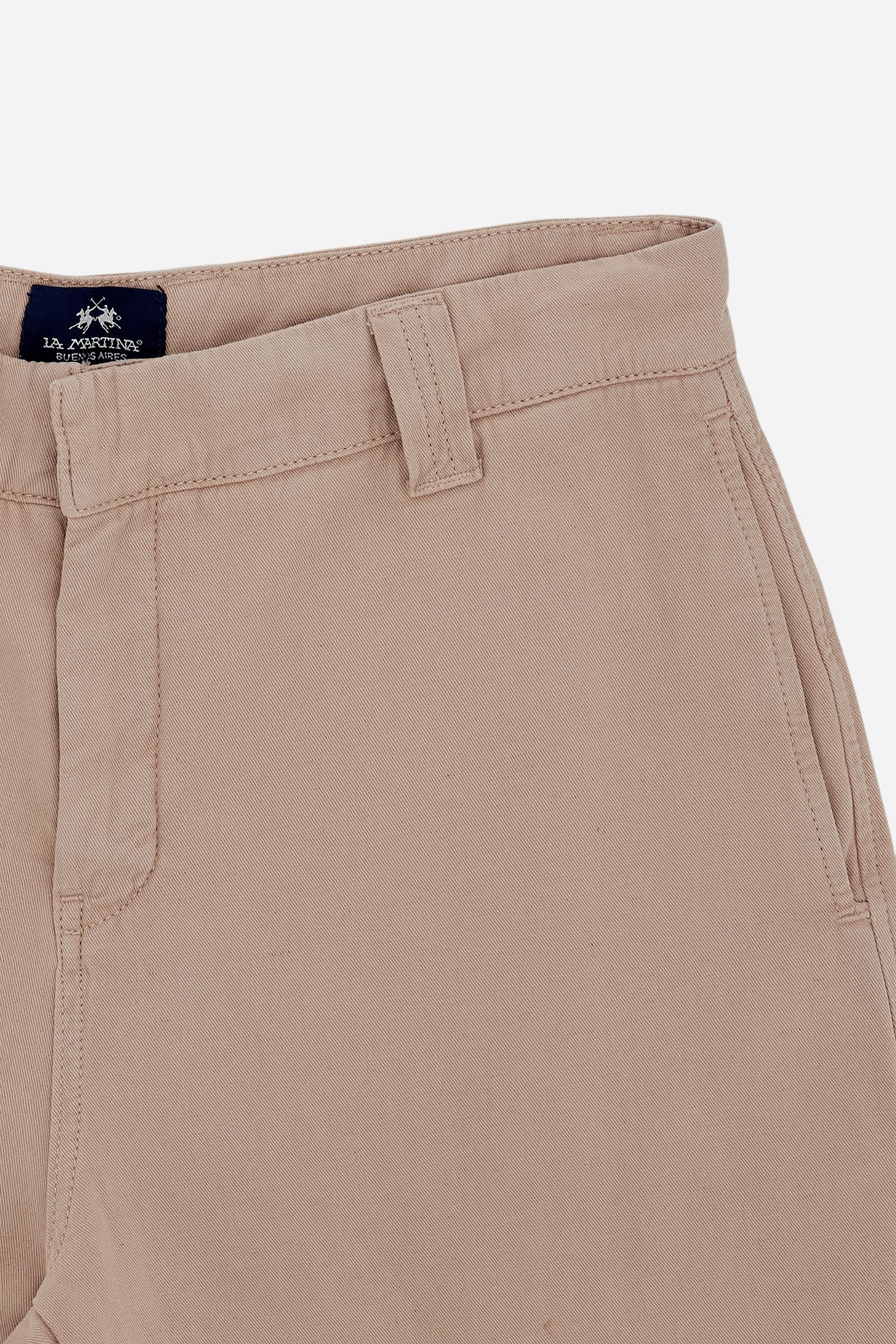 Men's chino trousers made from a lightweight cotton and linen blend fabric in solid color. The model features a classic zip and button closure, reinforced belt loops and side slant pockets. The back features welt pockets closed with customized horn-effect buttons. The regular cut with straight leg ensures comfort and freedom of movement. The Black Label Edition label is applied above the back pocket. The model is wearing size L. - Humus