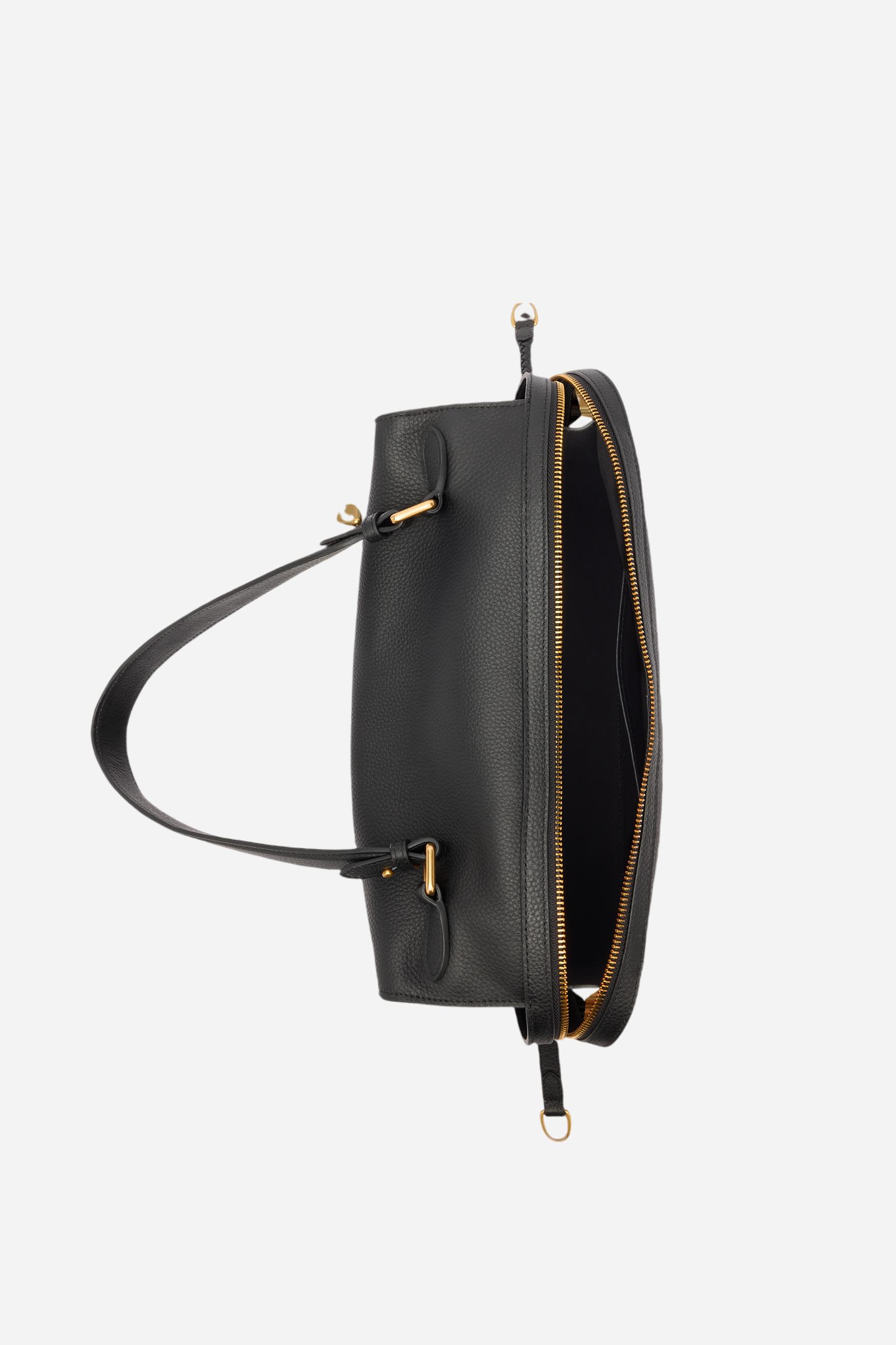 Large shoulder bag crafted from premium full-grain leather, known for its exquisite texture and exceptional durability. The slightly trapeze silhouette is accentuated by a double side zip with long leather pullers for easier access. A gold-tone metal logo plaque adorns the front, completing this timeless design. Dimensions:36 x 26 x 15 - Black