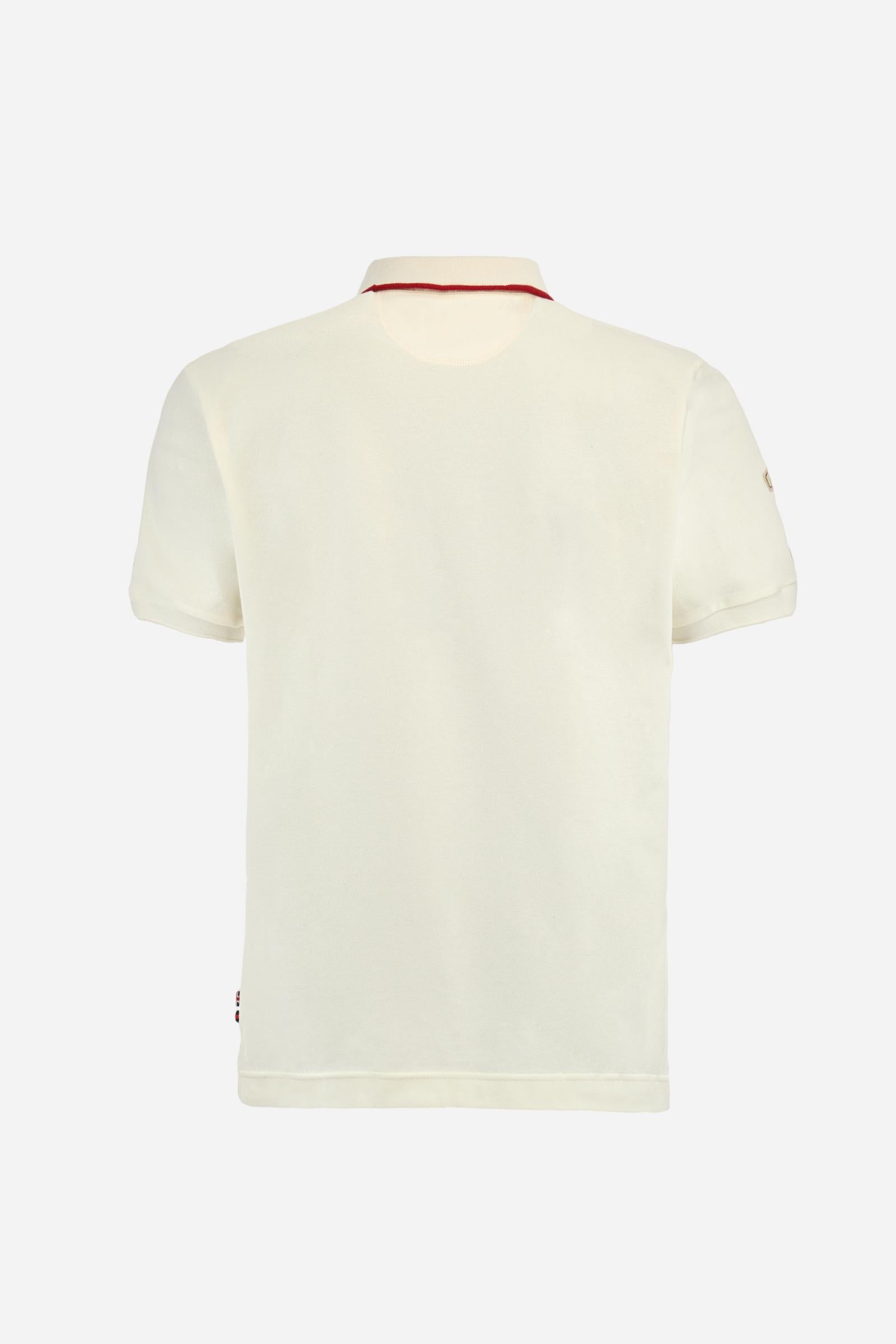 Short-sleeve polo shirt from the Guards capsule, made of high-quality stretch cotton piqué. Ribbed collar and cuffs in matching tone, with contrast striped detail on the collar. Three-button personalized placket. Multicolor graphics, patches, and lettering celebrate the British regiment, applied to chest and sleeves. Brand logo embroidered in contrast on the left sleeve. Regular straight fit. Model wears size L. - Pristine