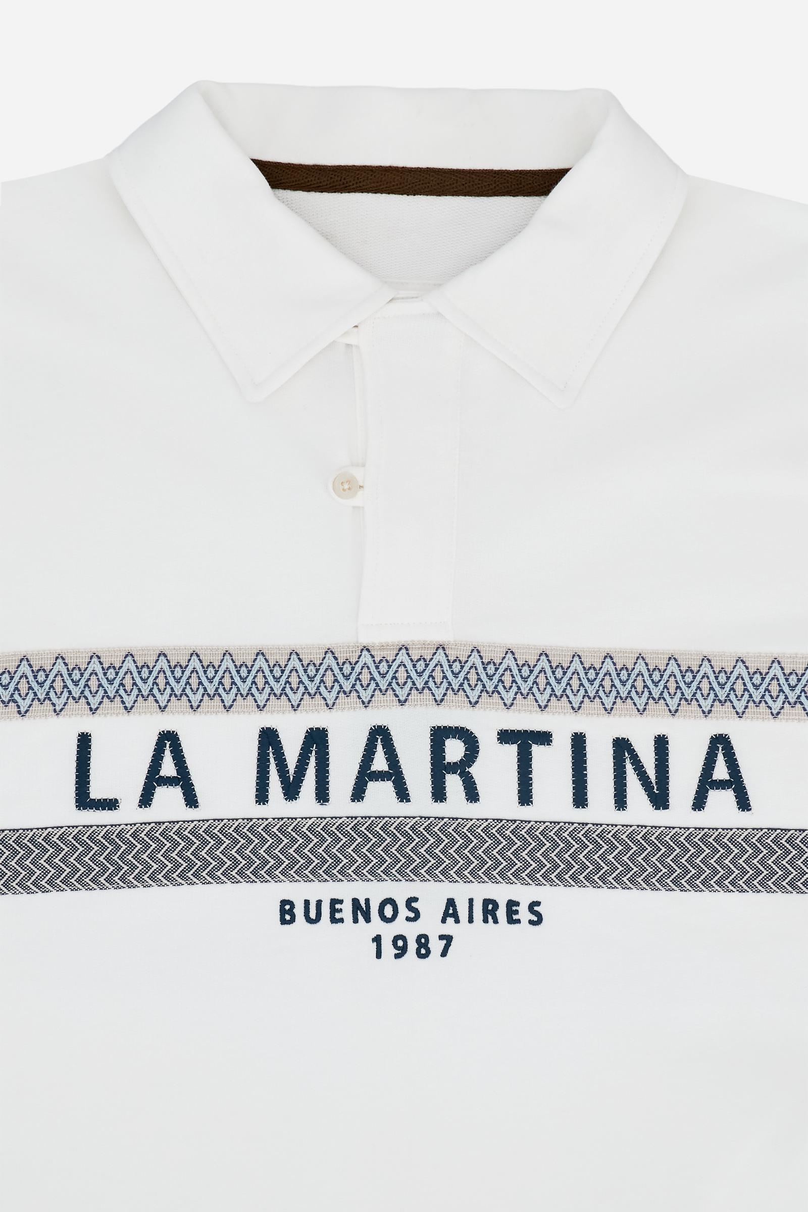 Short-sleeve polo in heavy cotton jersey with a compact structure and substantial hand feel. Contemporary fit with relaxed volume and slightly dropped shoulders. Classic collar with visible placket and bold horizontal band with geometric multicolor tapes. Raised “La Martina” embroidery on the chest and contrasting 3D logo on the back. - Off White
